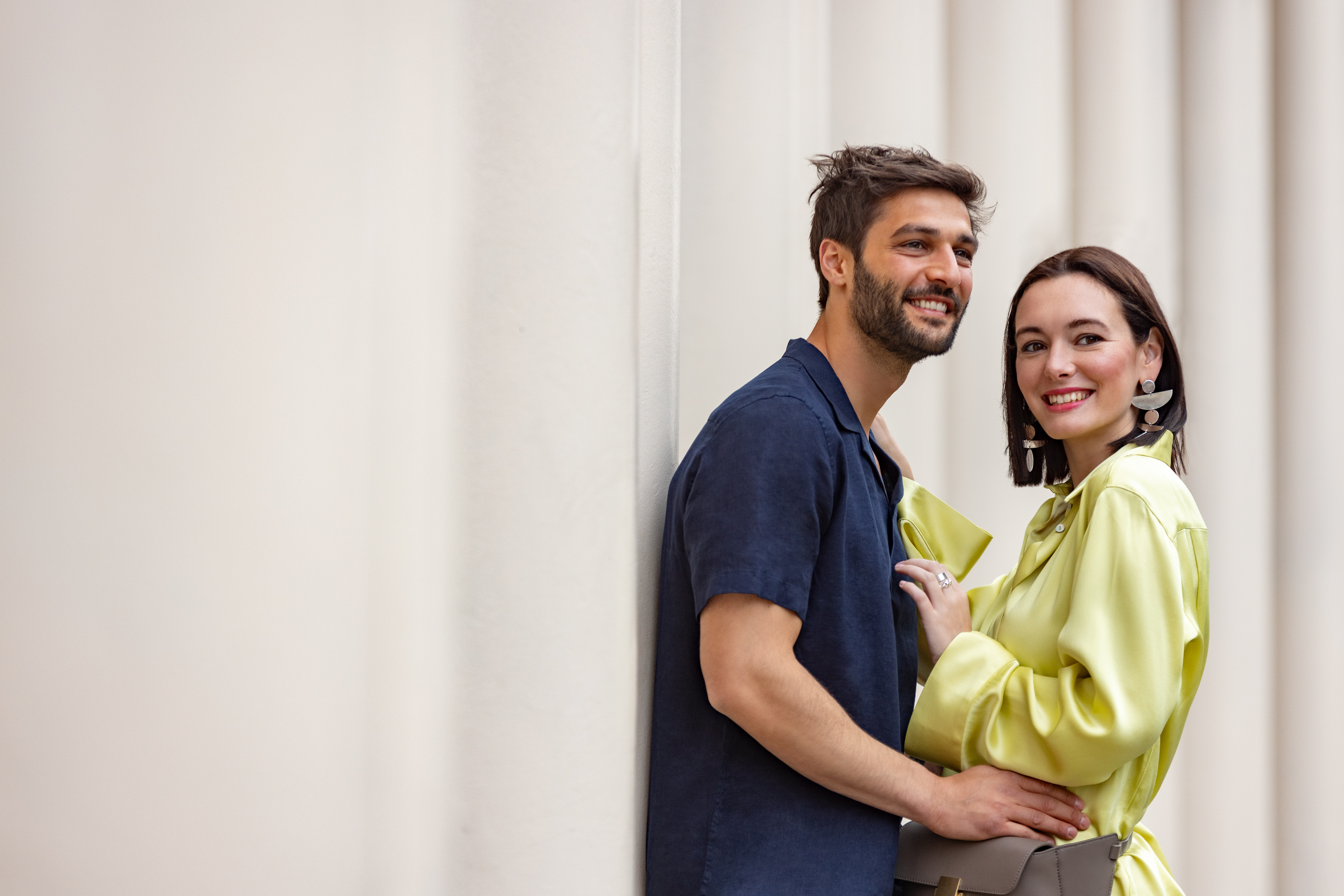 a man and woman standing next to each other
