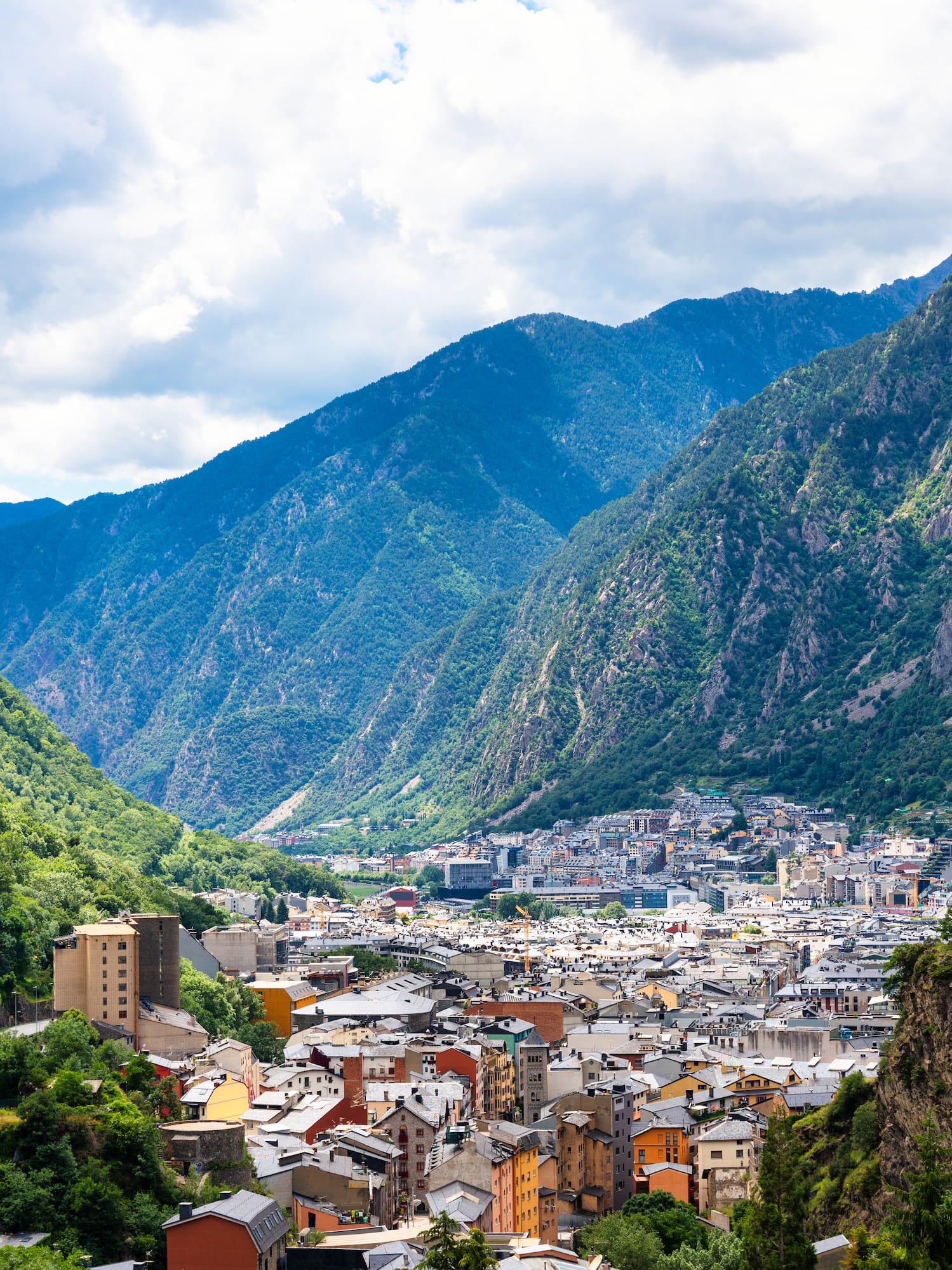 a city in a valley with mountains