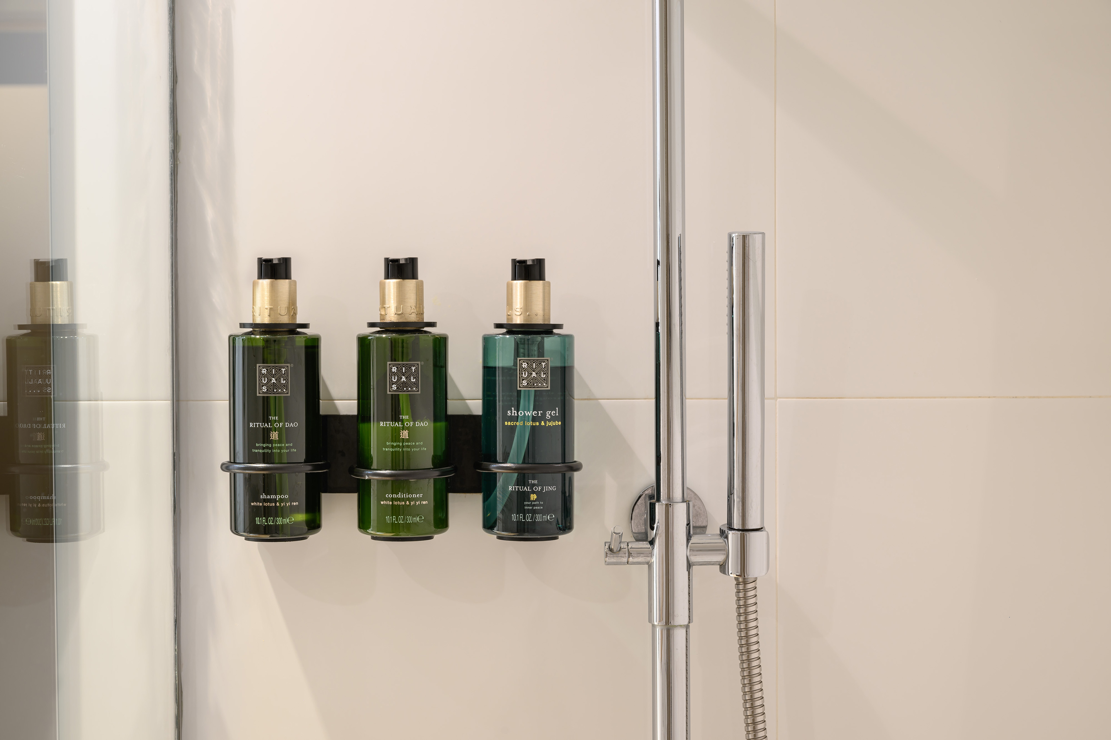 Rituals hotel shower amenities: shampoo, conditioner, and shower gel.