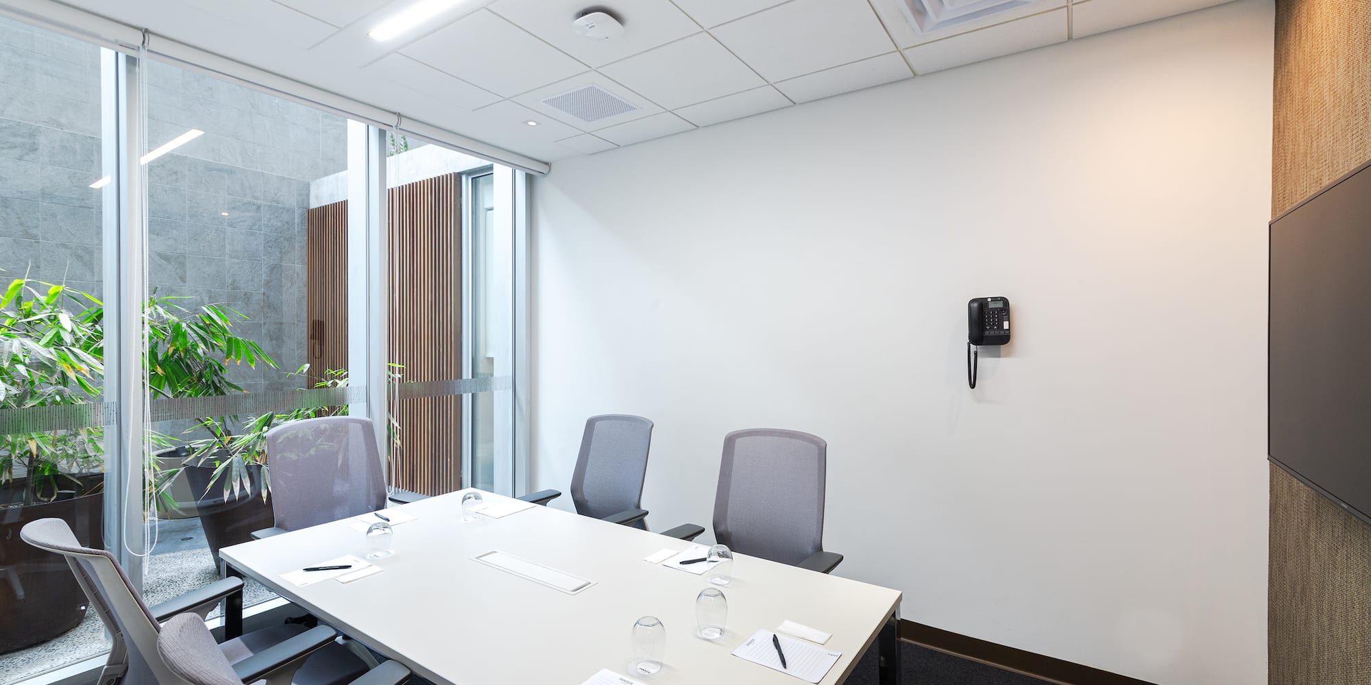 a conference room with a table and chairs