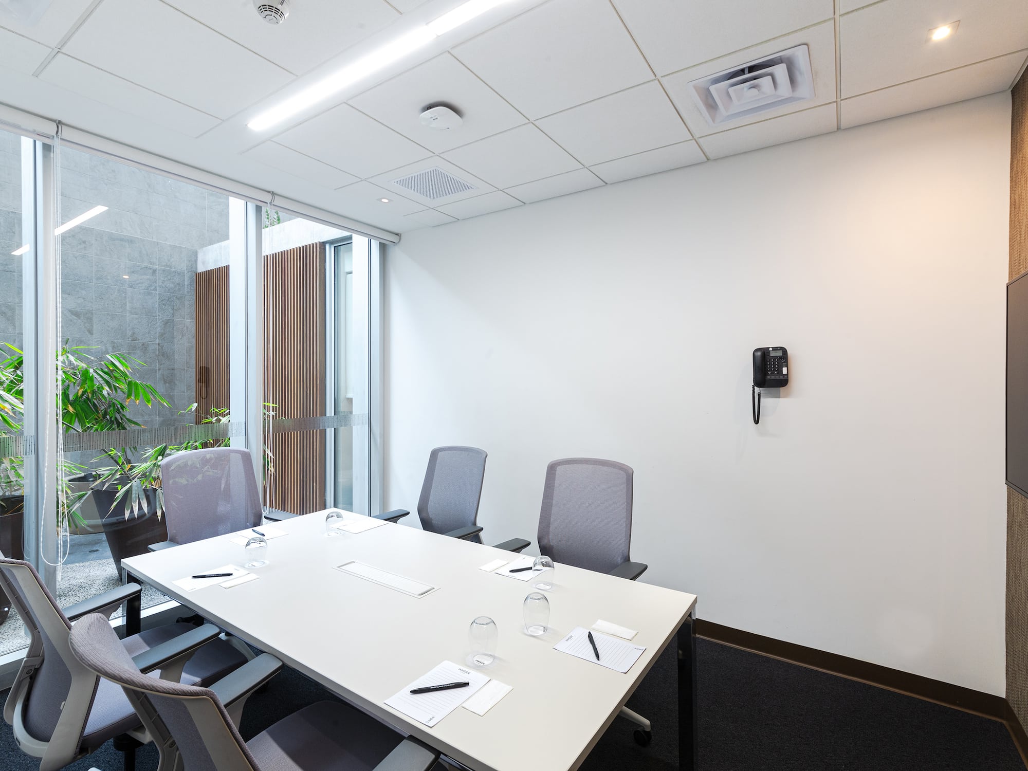 a conference room with a table and chairs