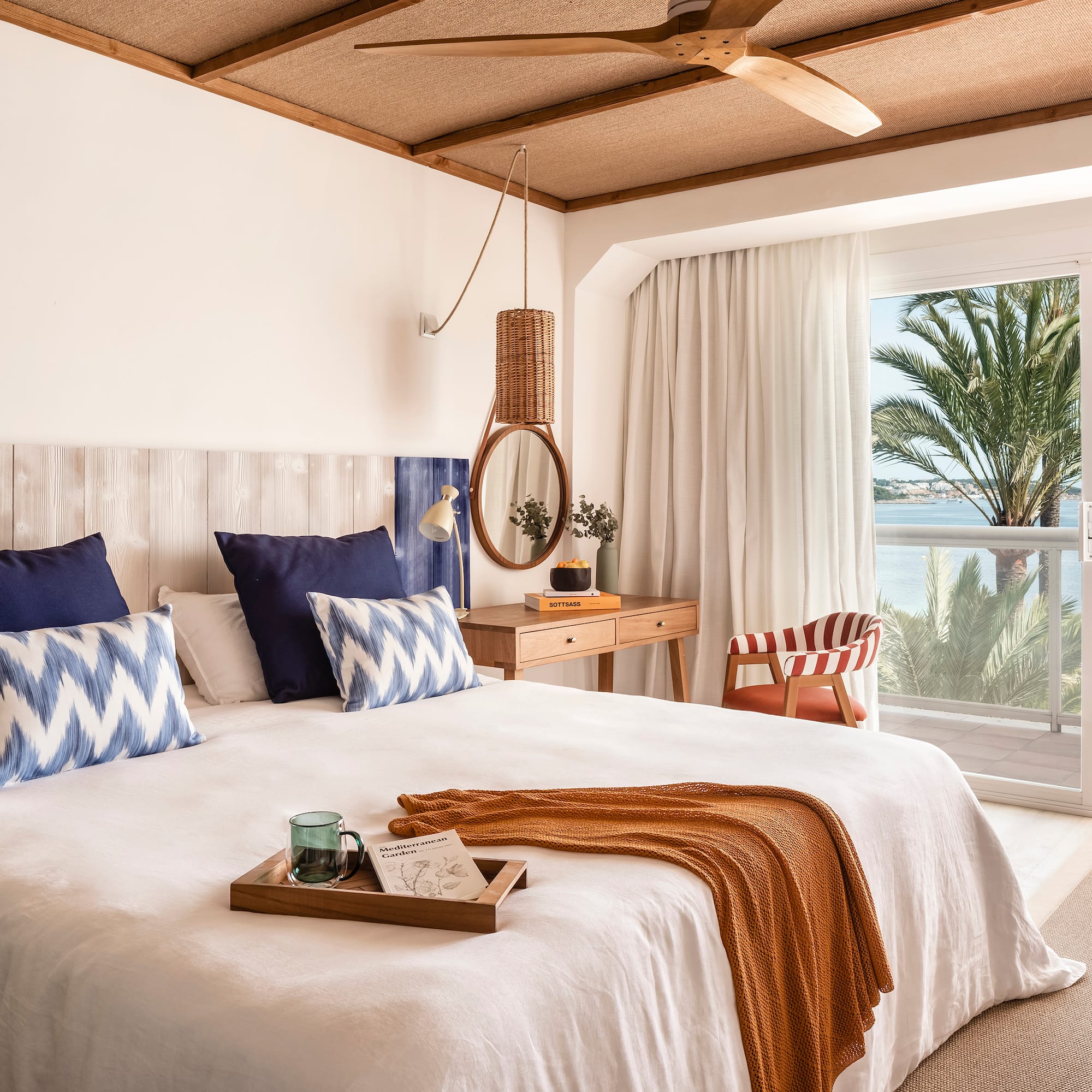 a bedroom with a large bed and a window