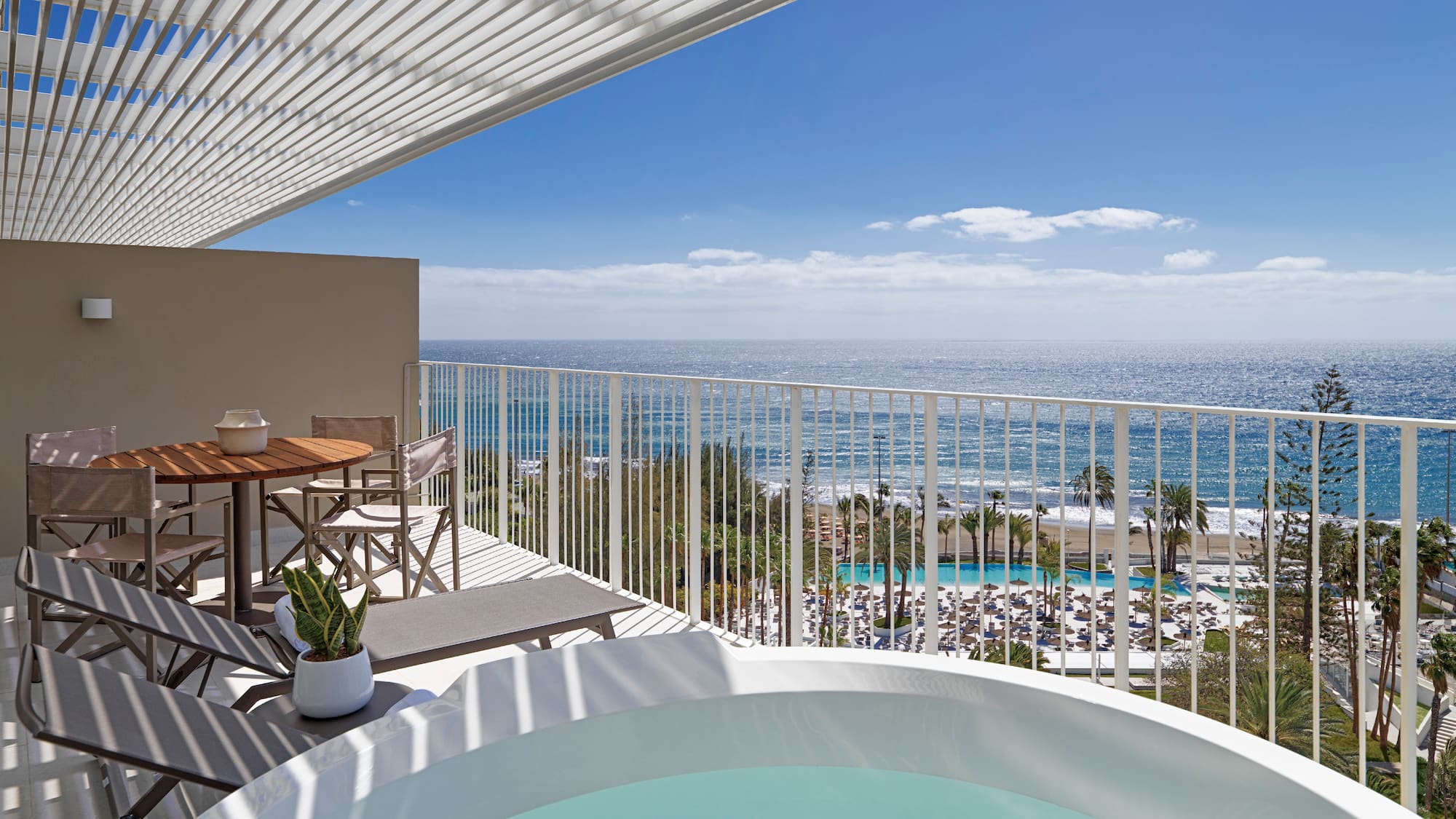 a hot tub with a view of the ocean