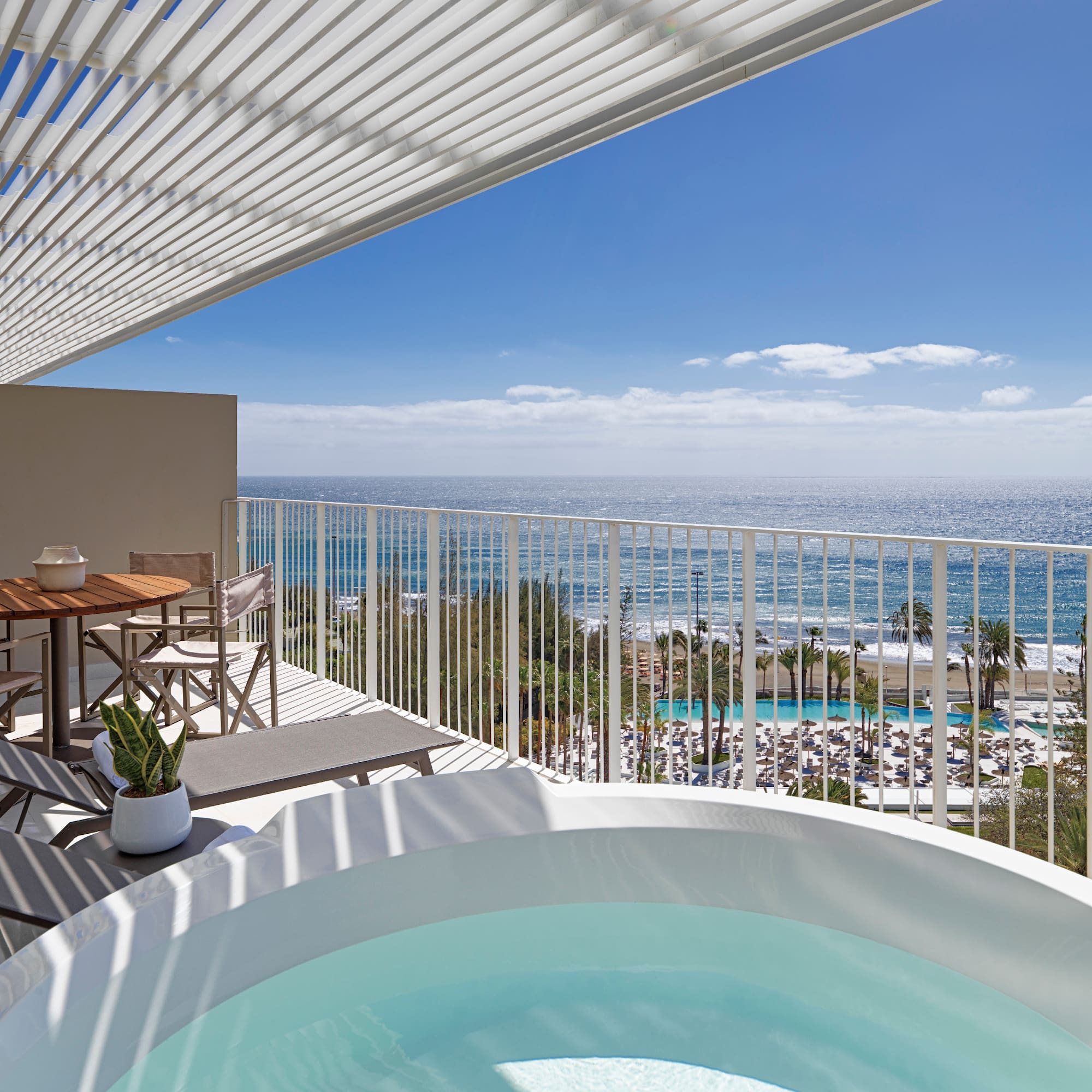 a hot tub with a view of the ocean