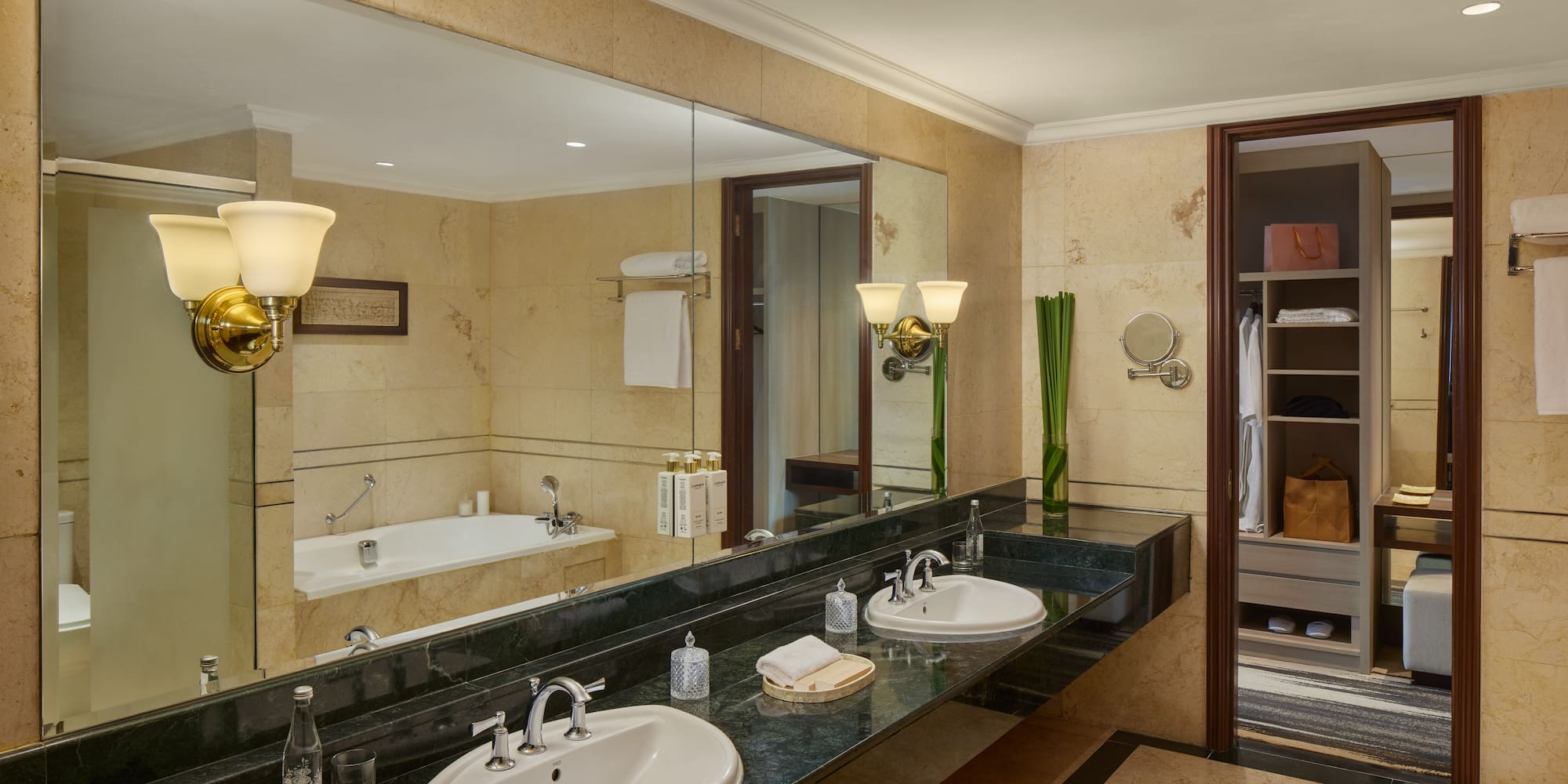 a bathroom with a large mirror and sinks