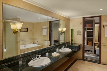 a bathroom with a large mirror and sinks