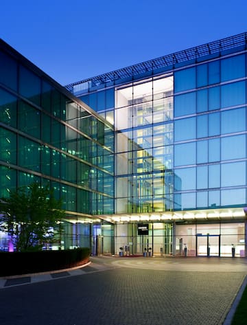 a building with glass walls and a walkway