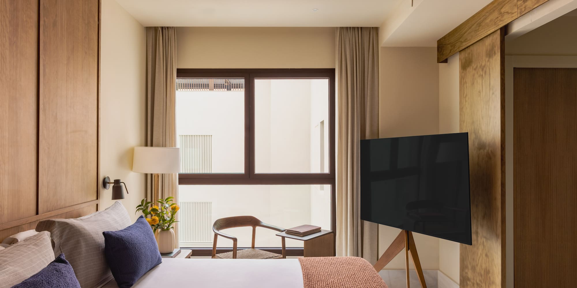 a room with a tv and a bed