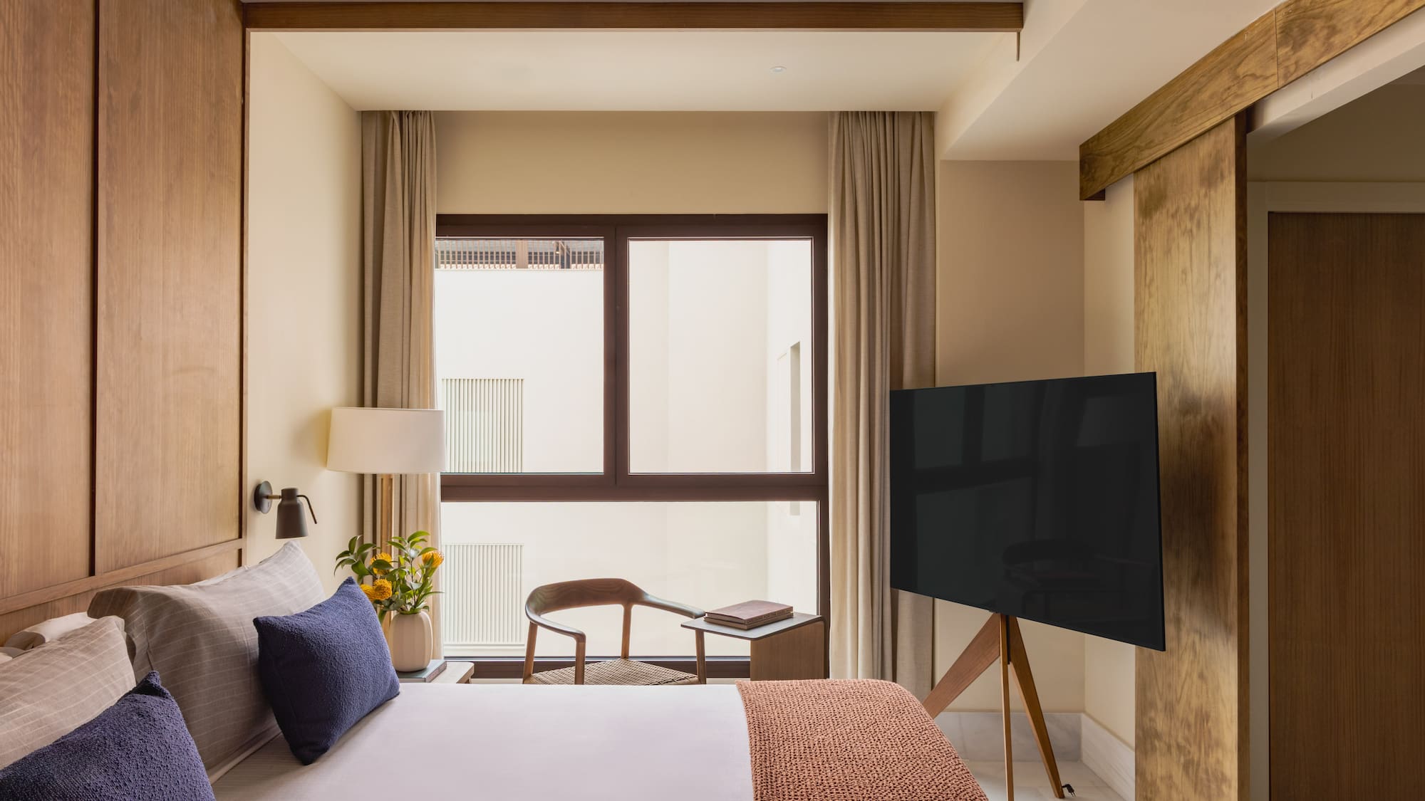 a room with a tv and a bed