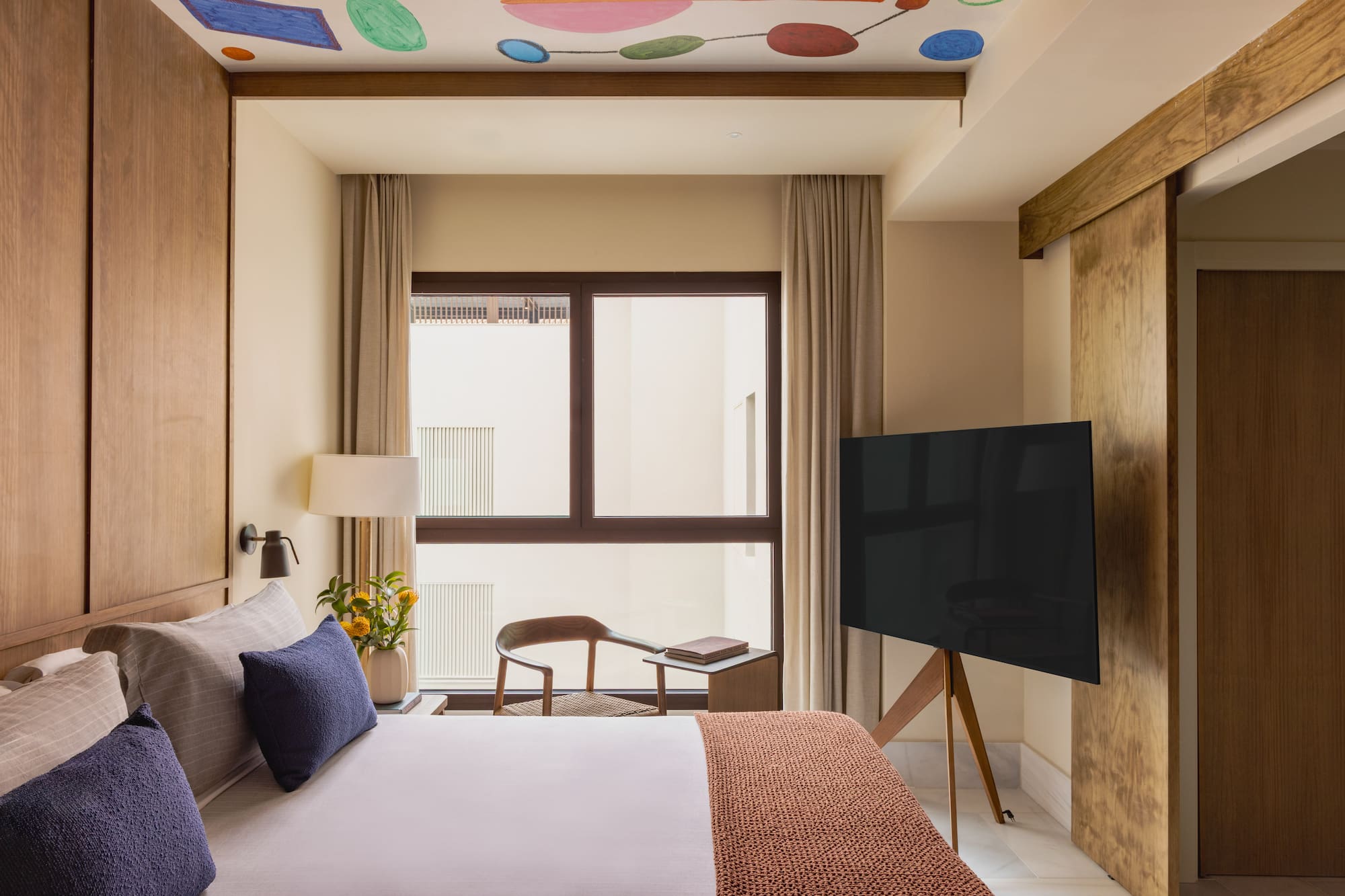 a room with a tv and a bed