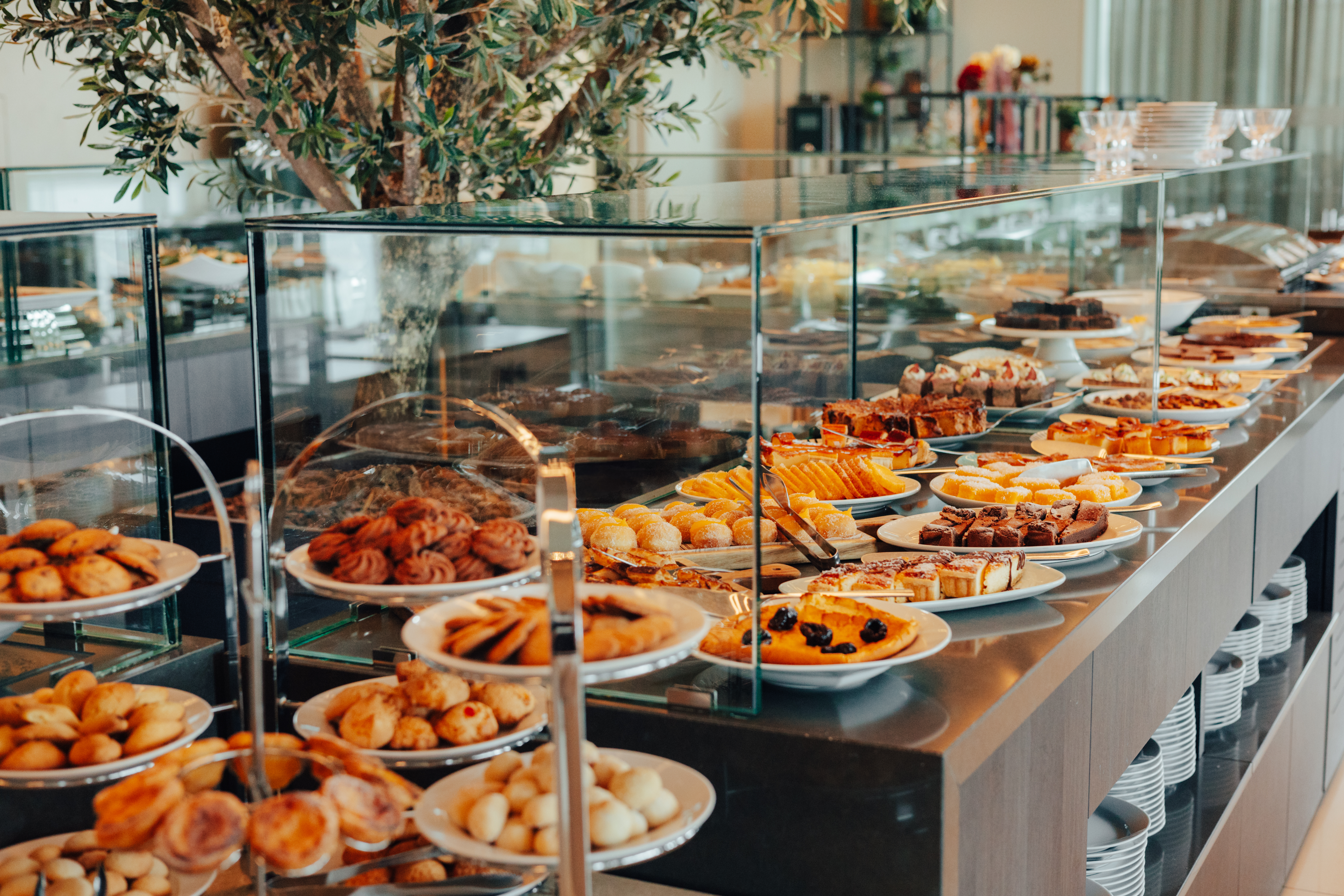 Extensive hotel dessert buffet with cakes, cookies, and pastries.