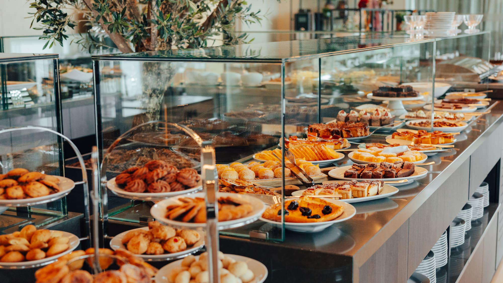 Extensive hotel dessert buffet with cakes, cookies, and pastries.