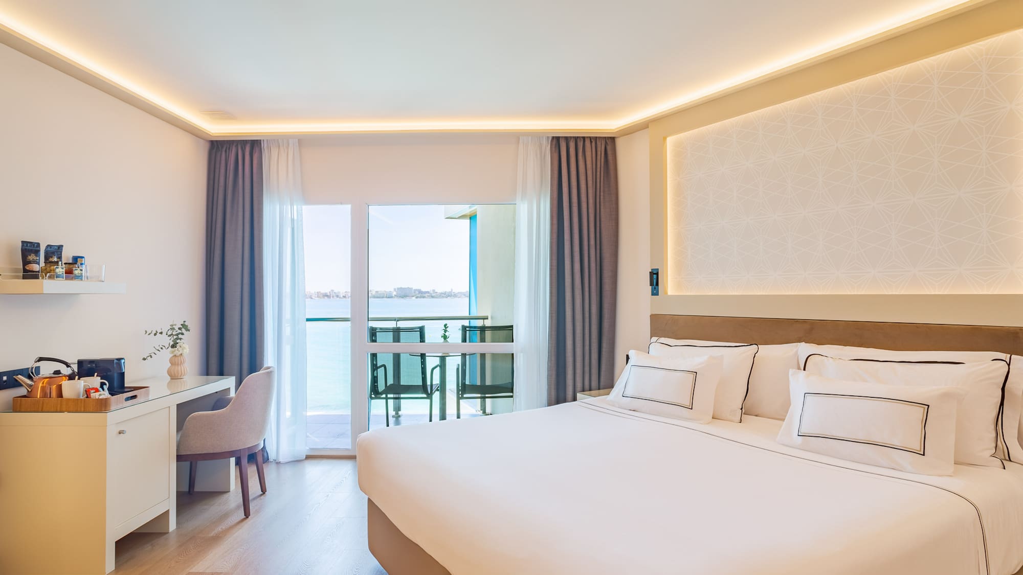 a room with a bed and a desk and chair