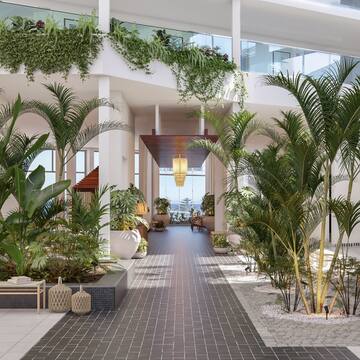 a room with plants and a large balcony