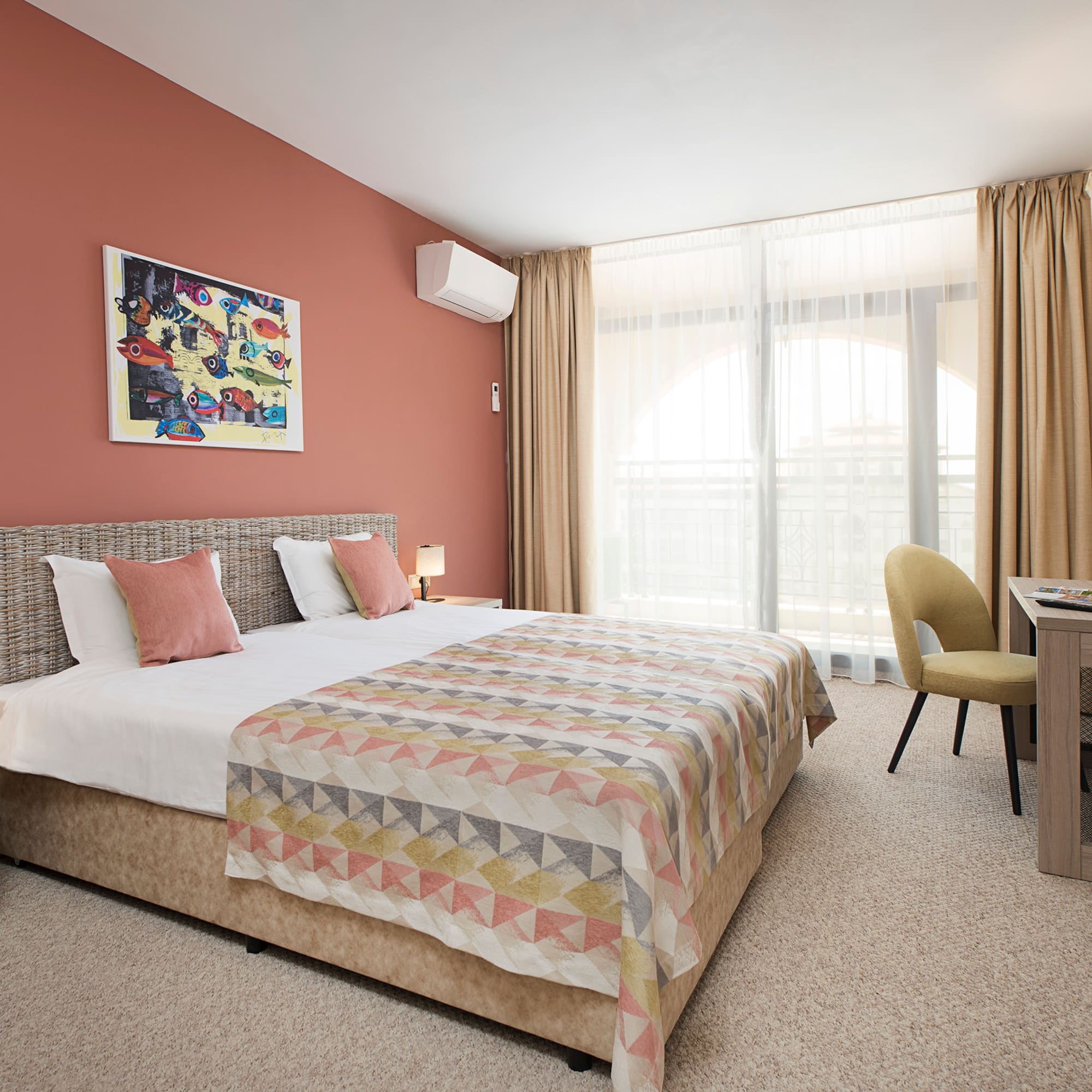 a bedroom with a bed and a desk