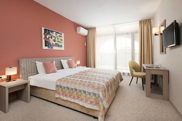 a bedroom with a bed and a desk