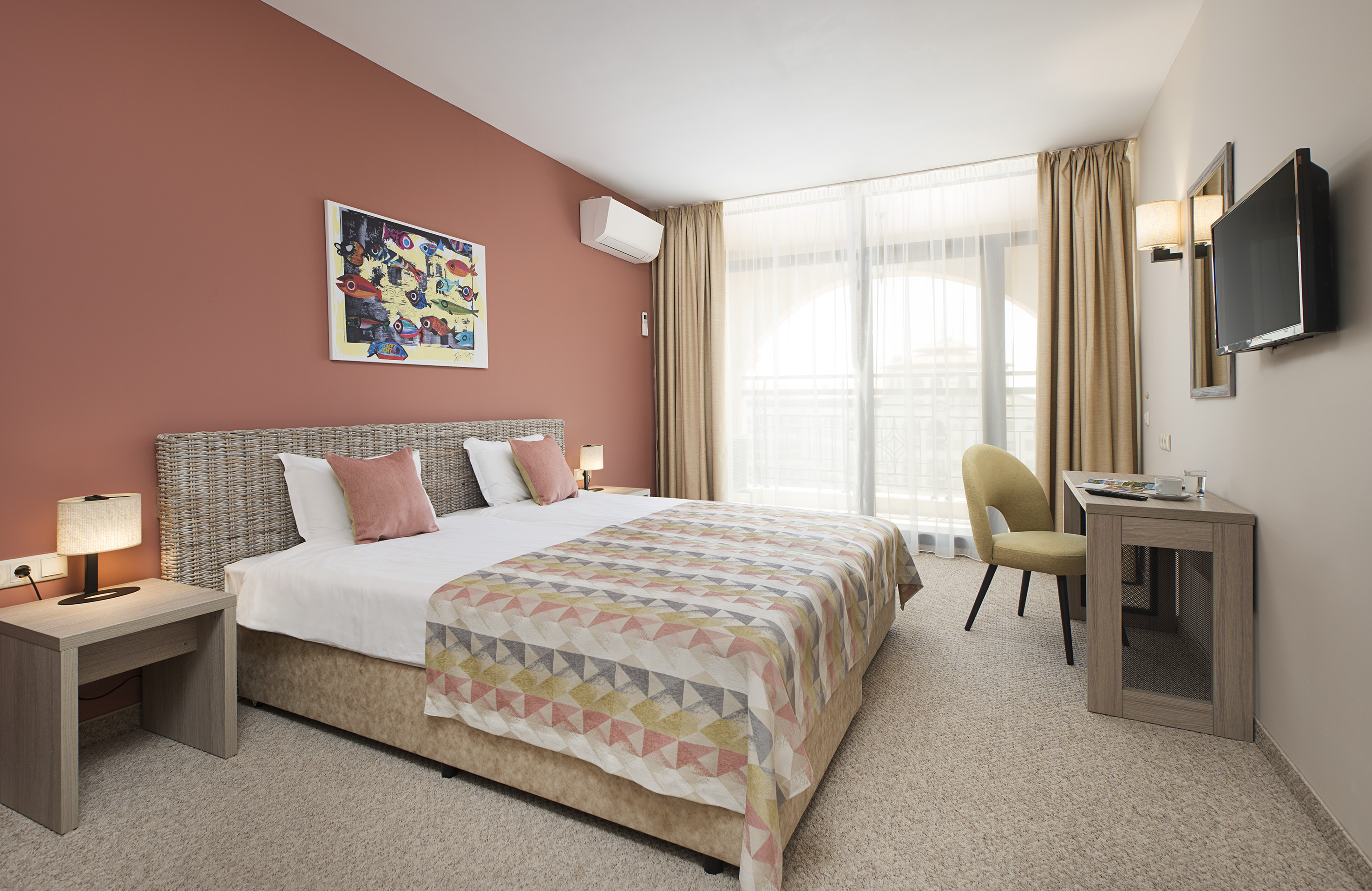 a bedroom with a bed and a desk
