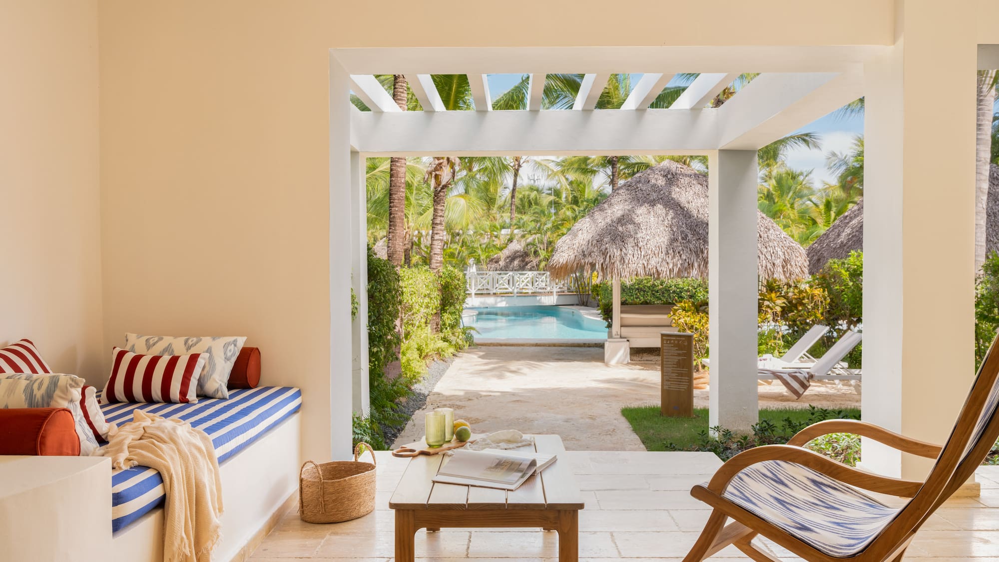 a room with a pool and chairs