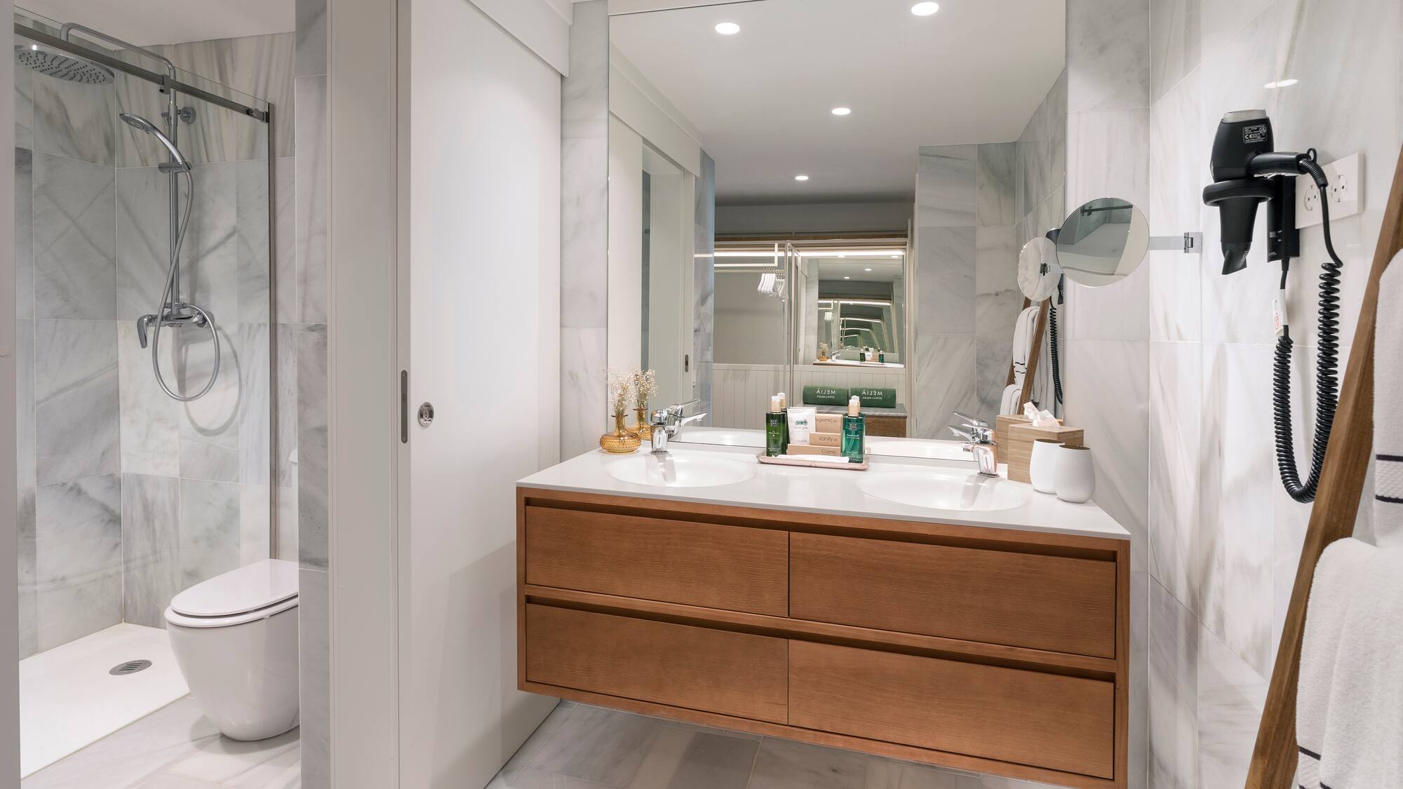 a bathroom with a large mirror and a sink