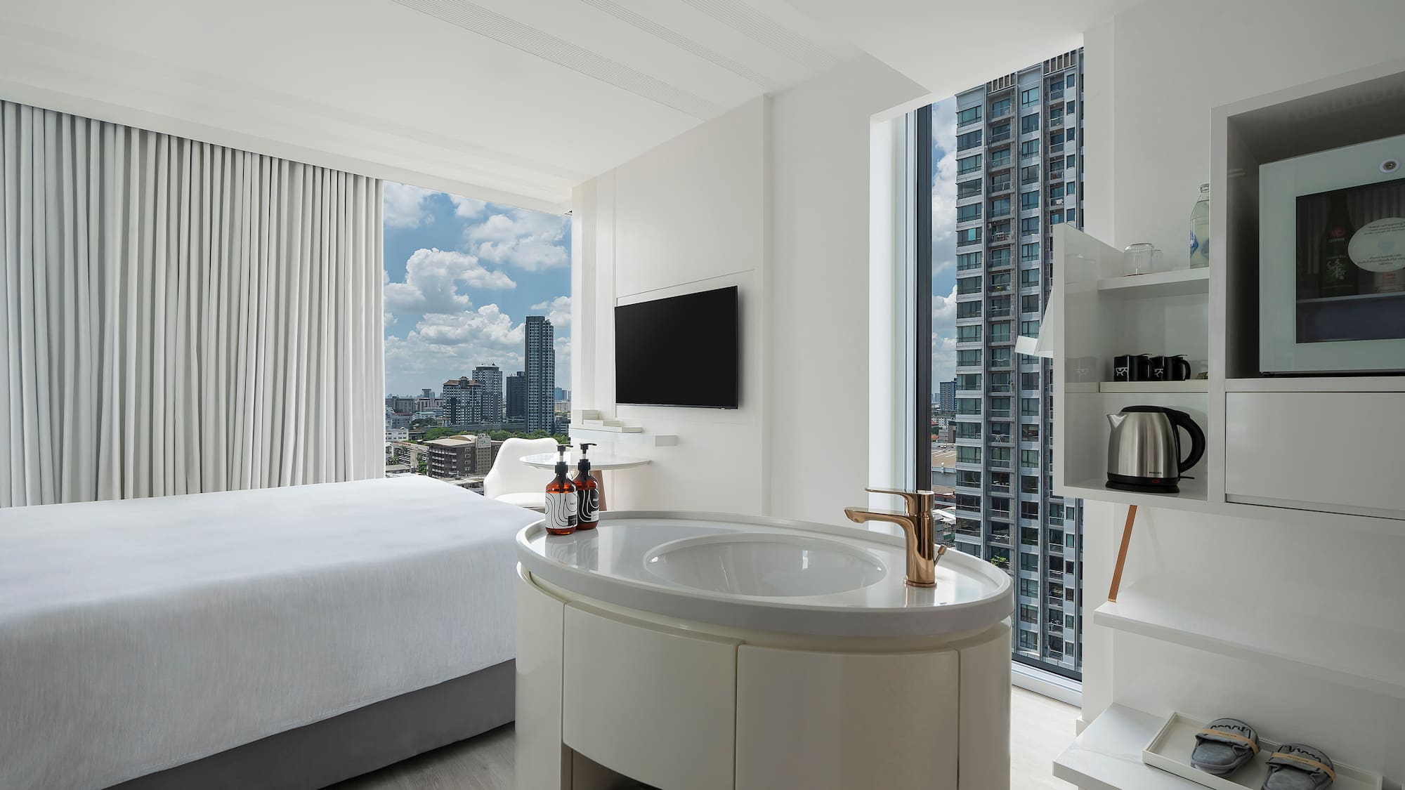 a room with a bed and a sink