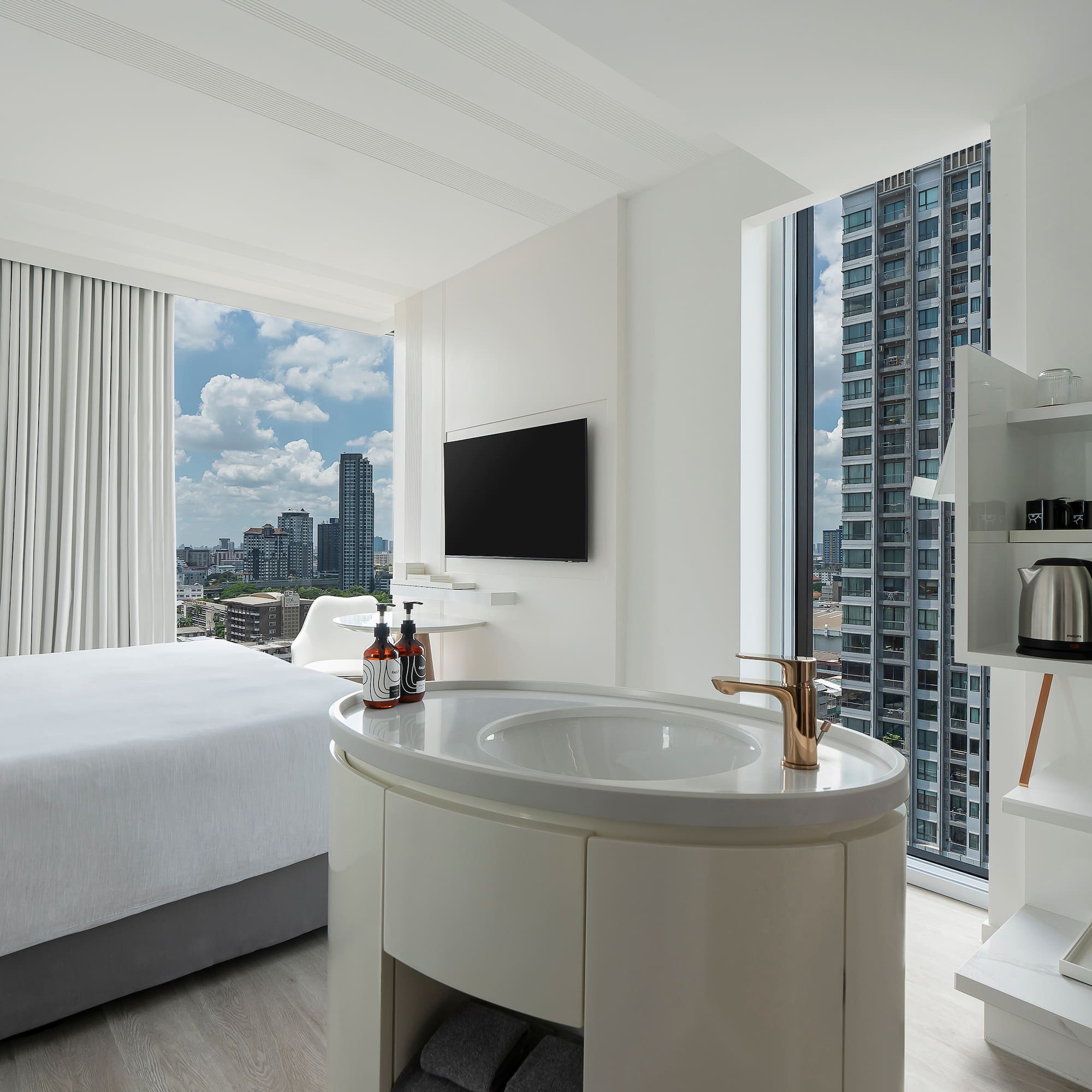 a room with a bed and a sink