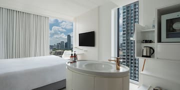 a room with a bed and a sink