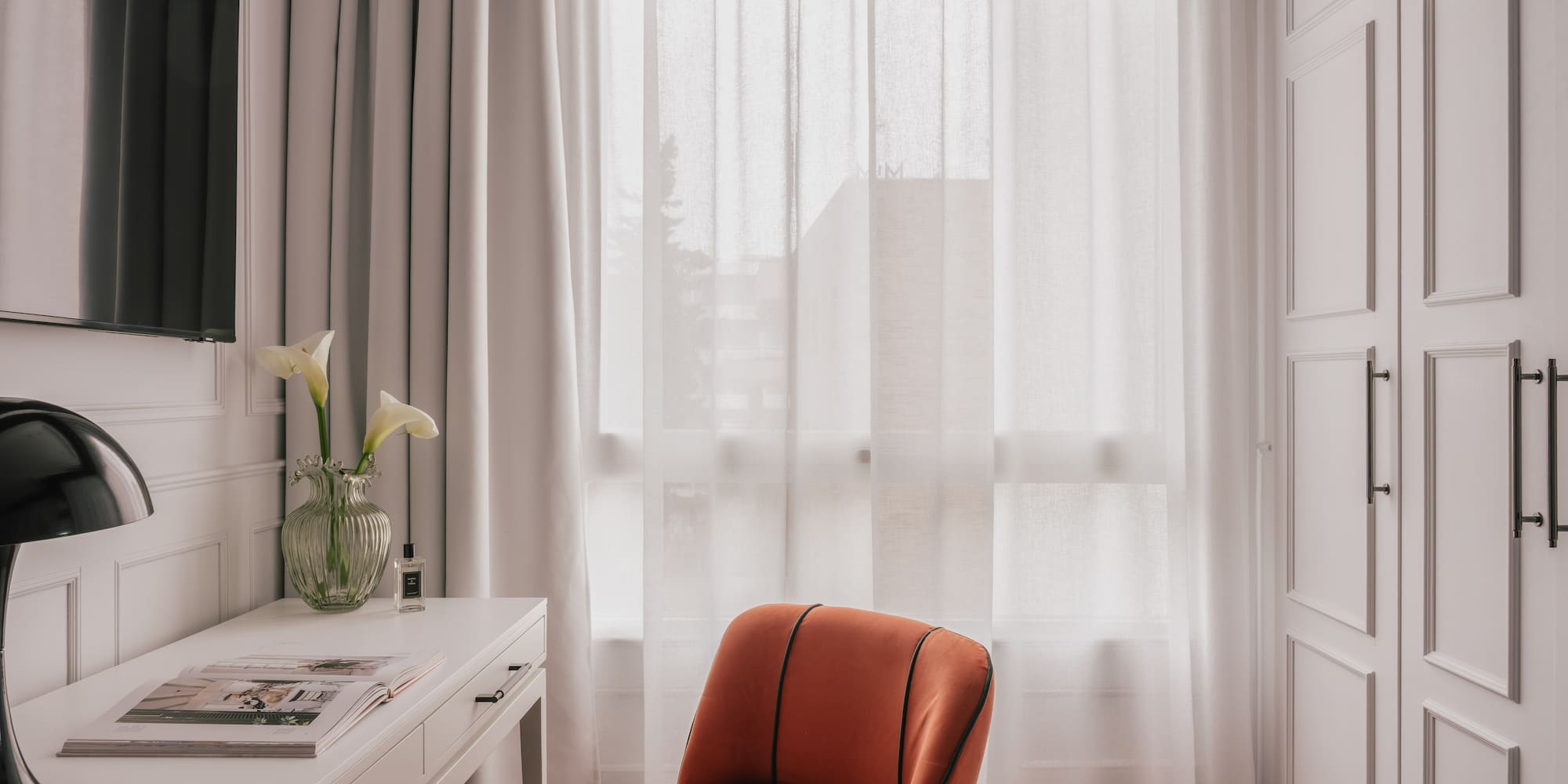 a room with a couch and a mirror