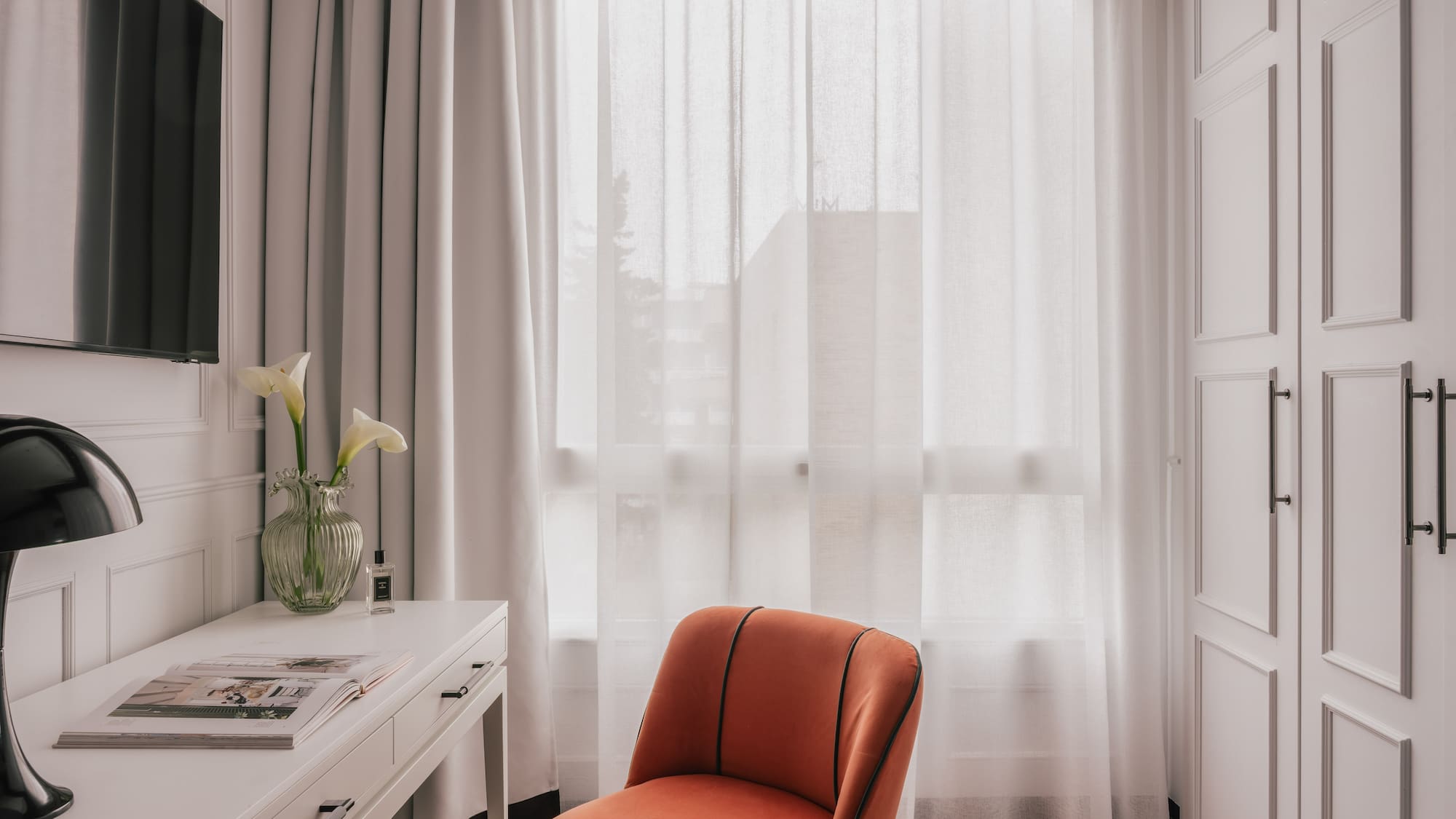a room with a couch and a mirror