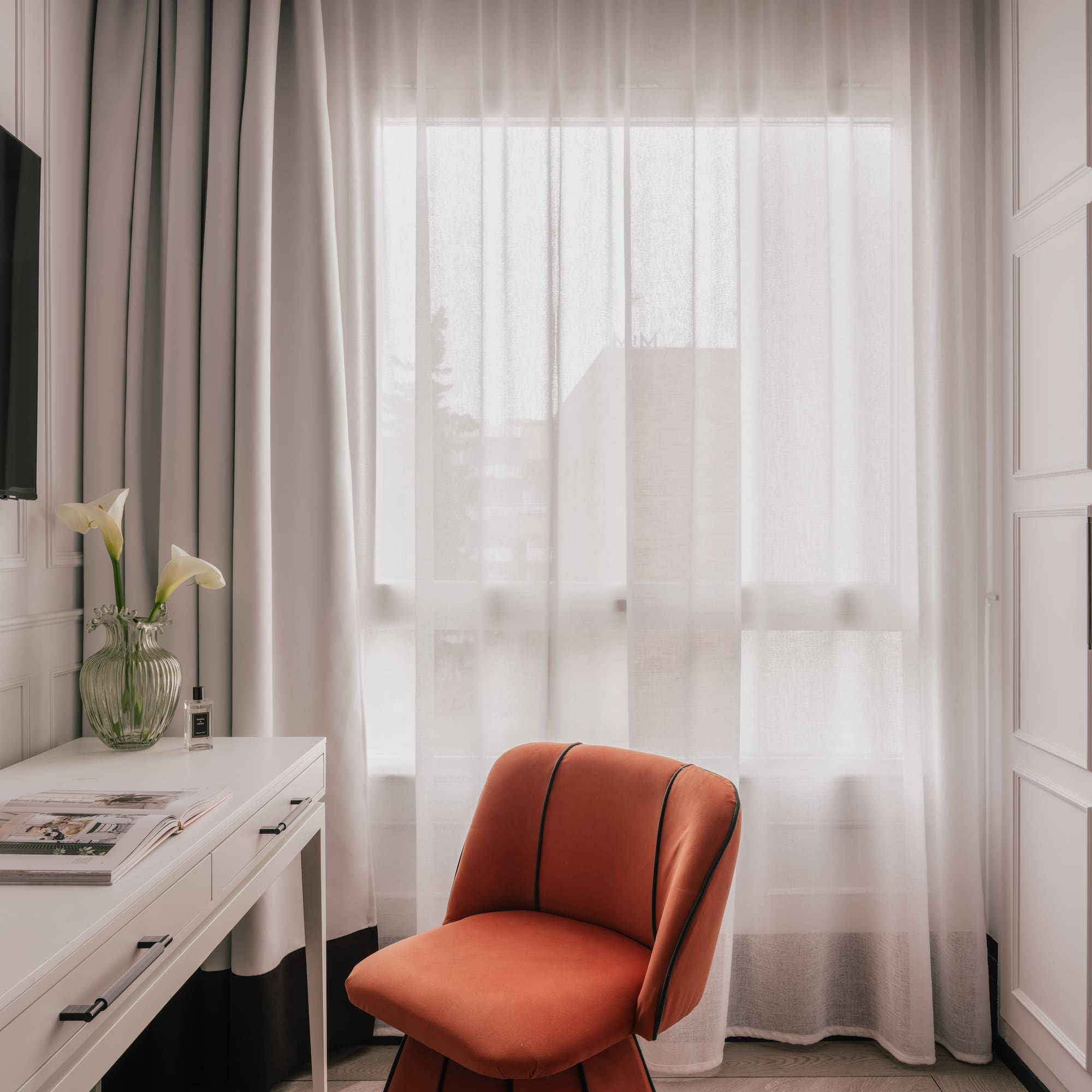 a room with a couch and a mirror