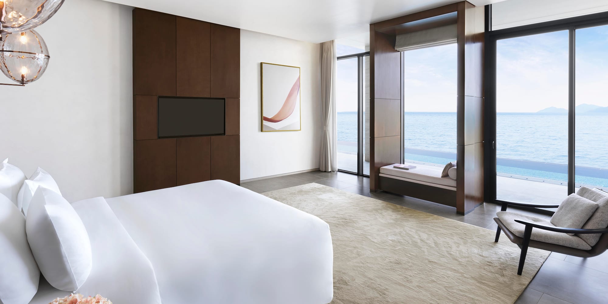 a room with a bed and a television