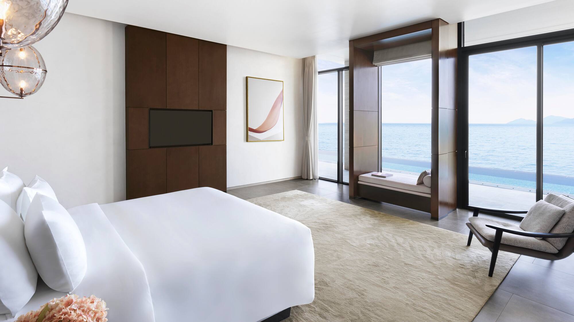 a room with a bed and a television