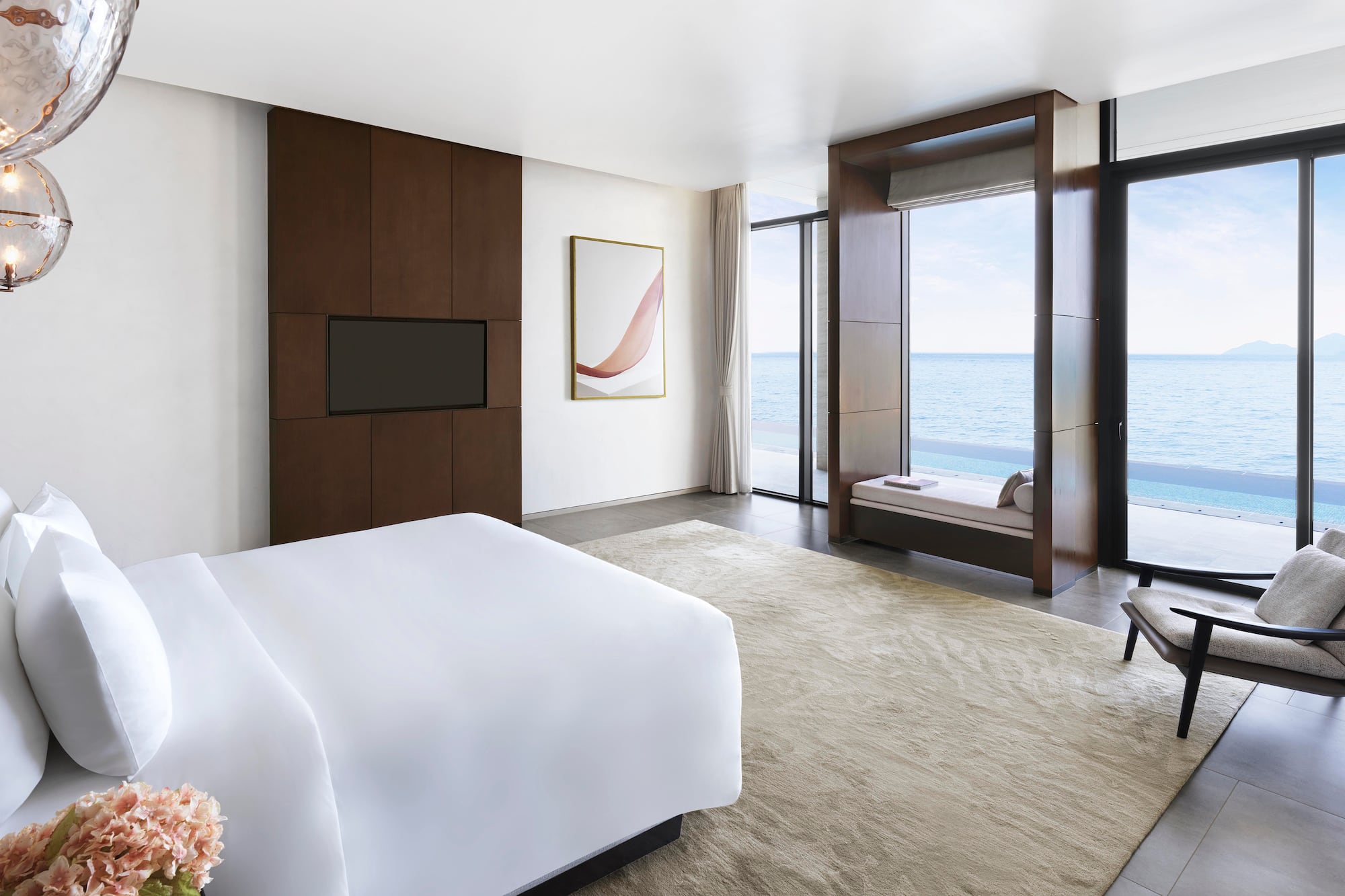 a room with a bed and a television