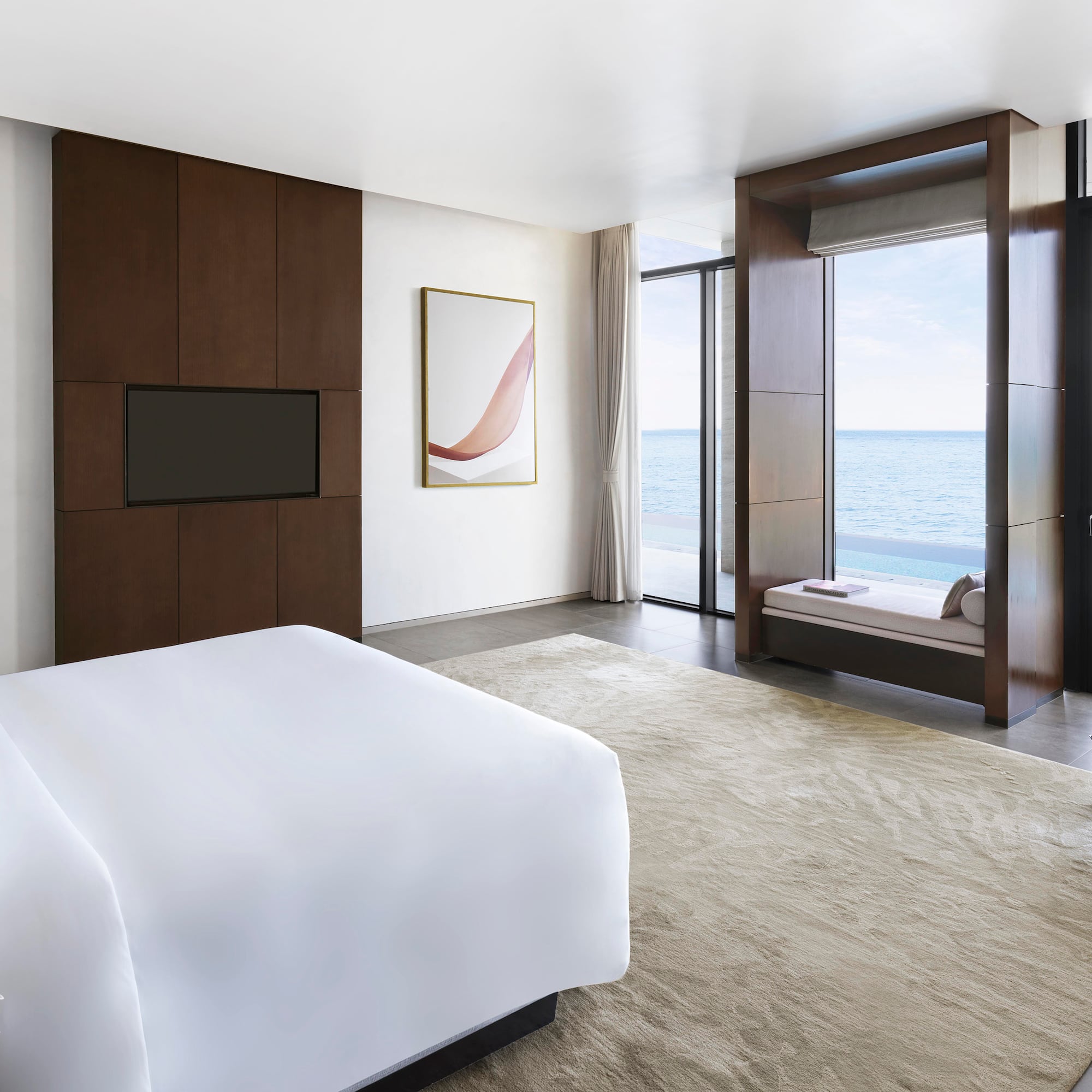 a room with a bed and a television