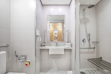 a bathroom with a shower and sink