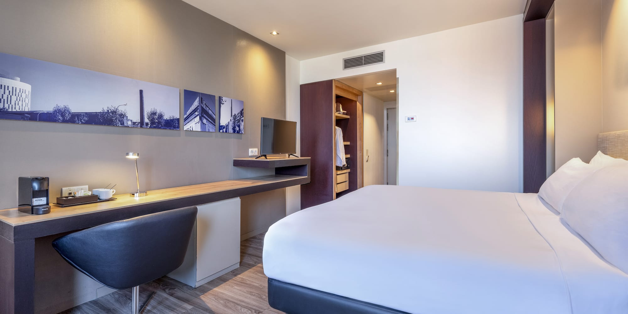 a room with a bed and desk