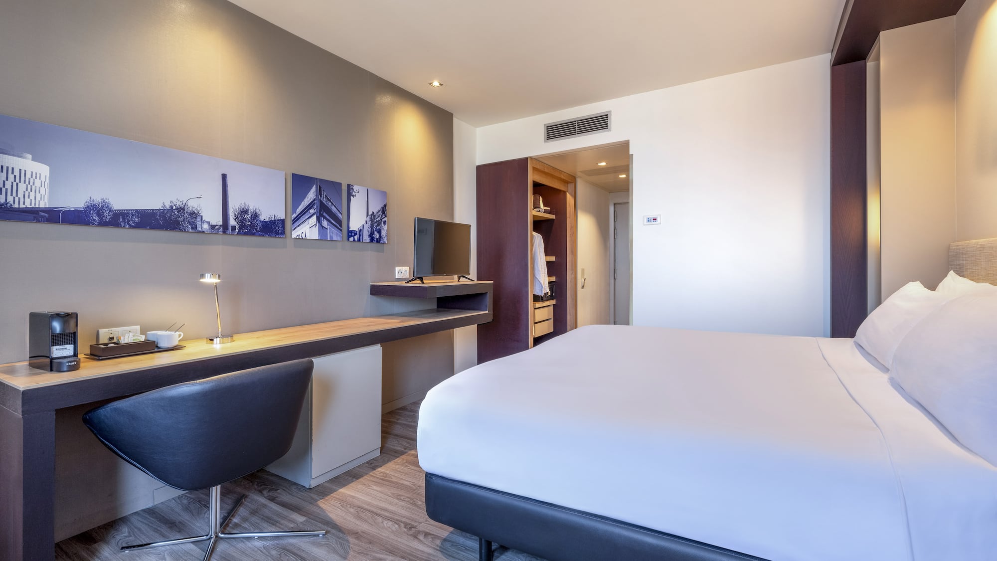 a room with a bed and desk