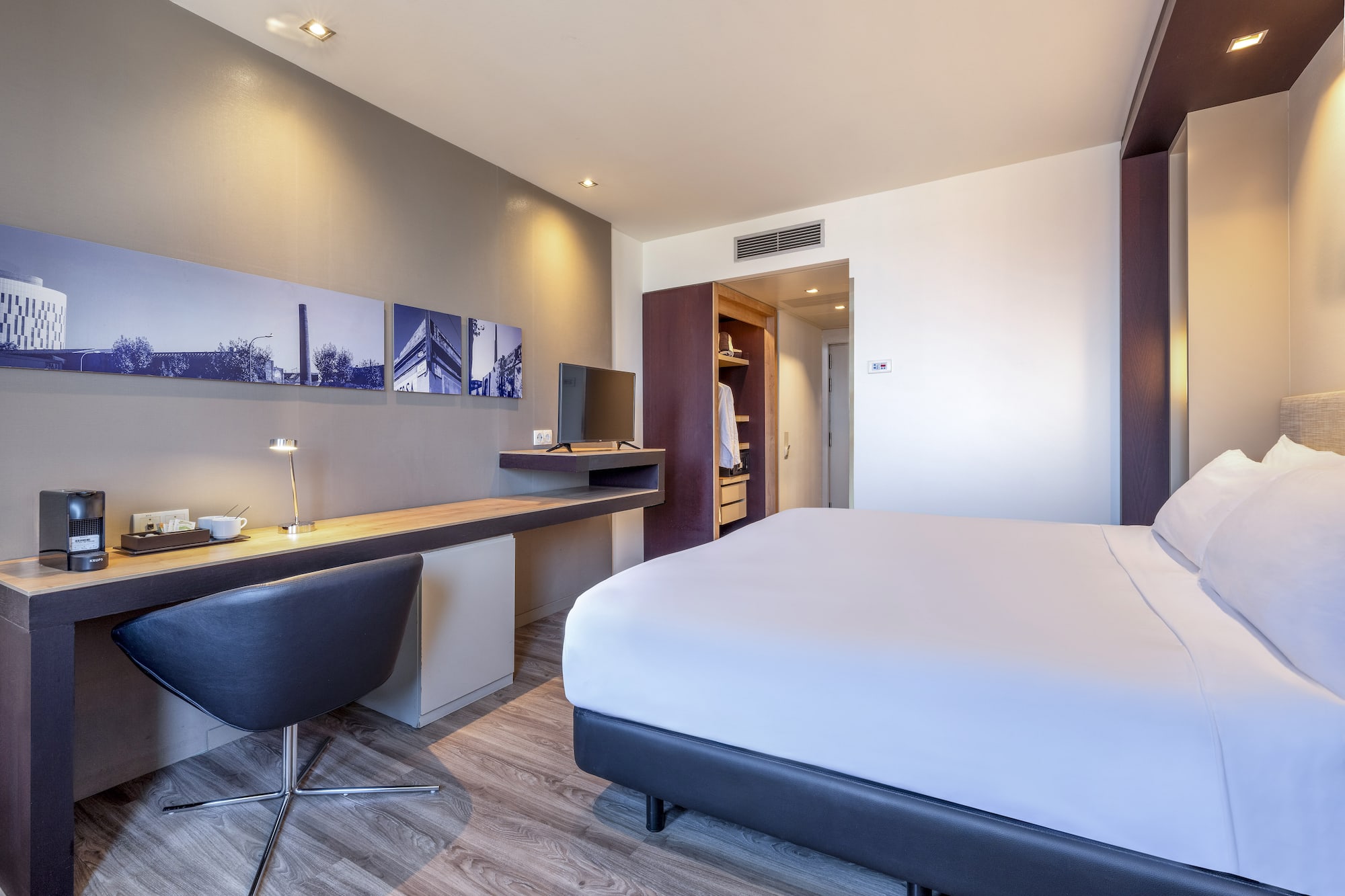 a room with a bed and desk