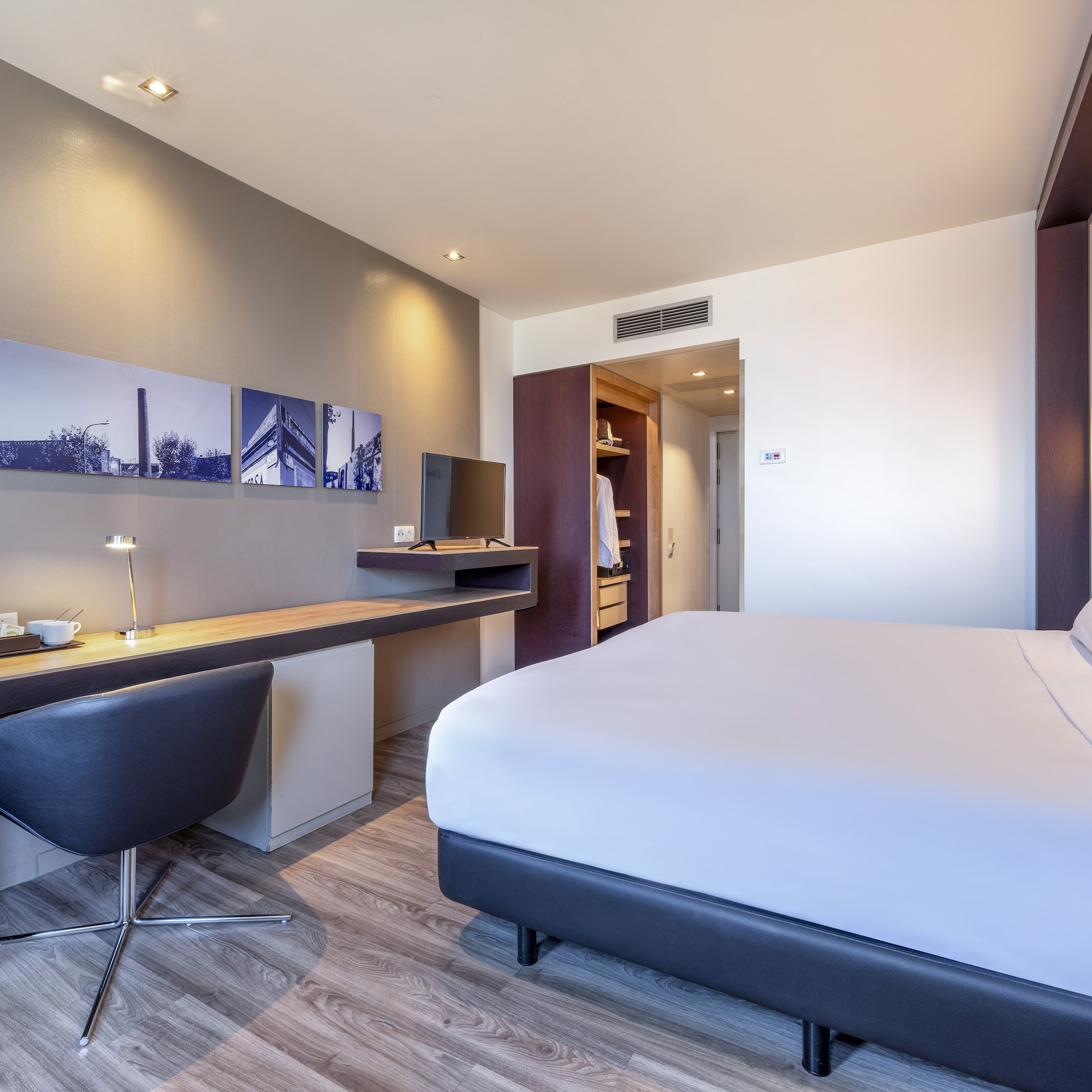 a room with a bed and desk