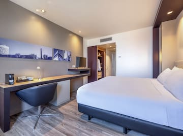 a room with a bed and desk