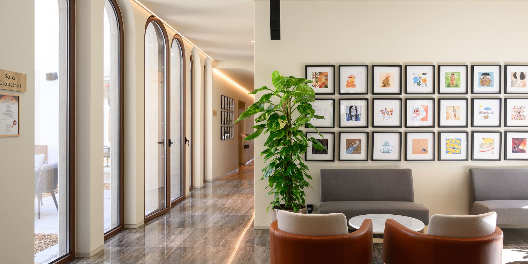 a room with a couch and a plant