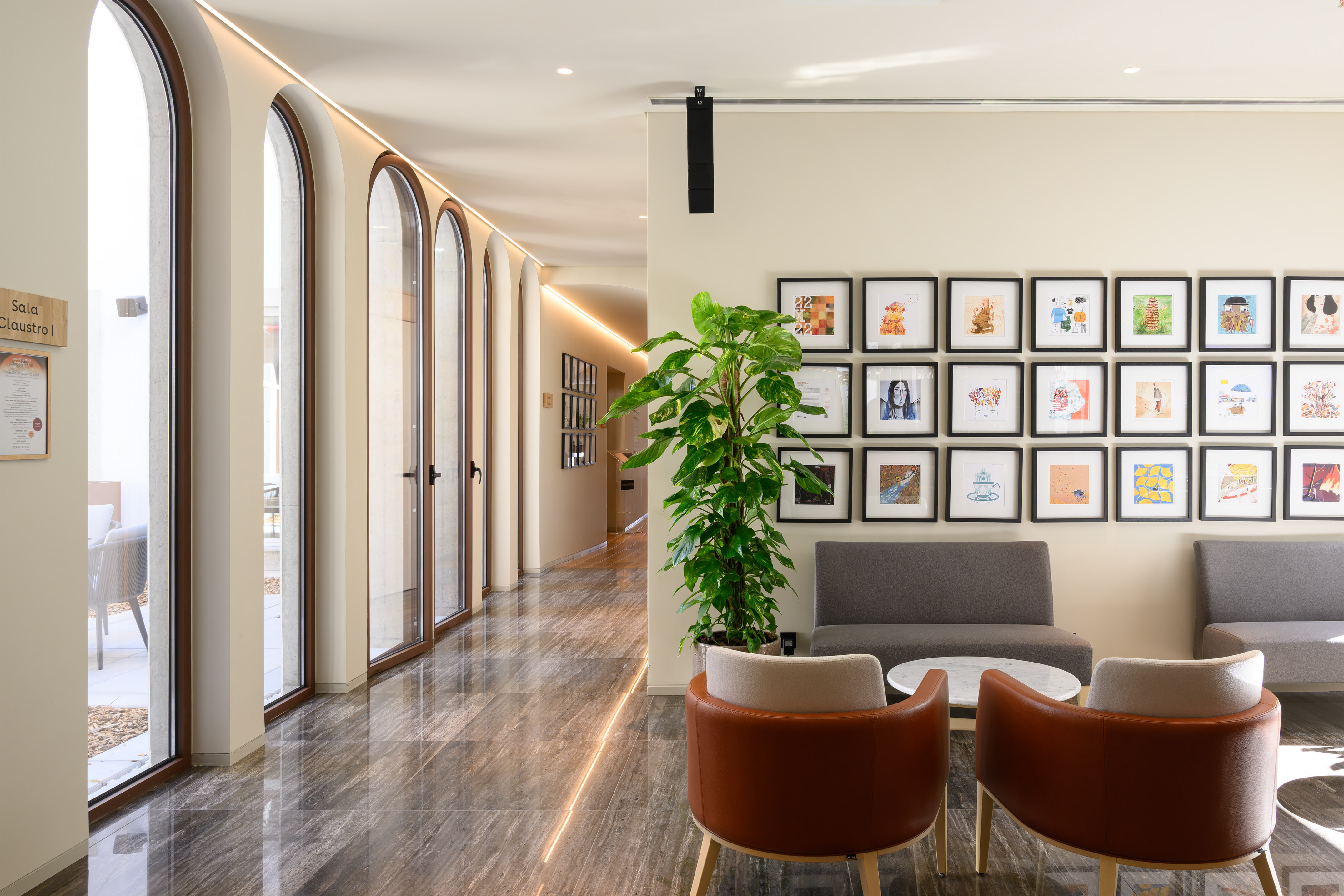 a room with a couch and a plant