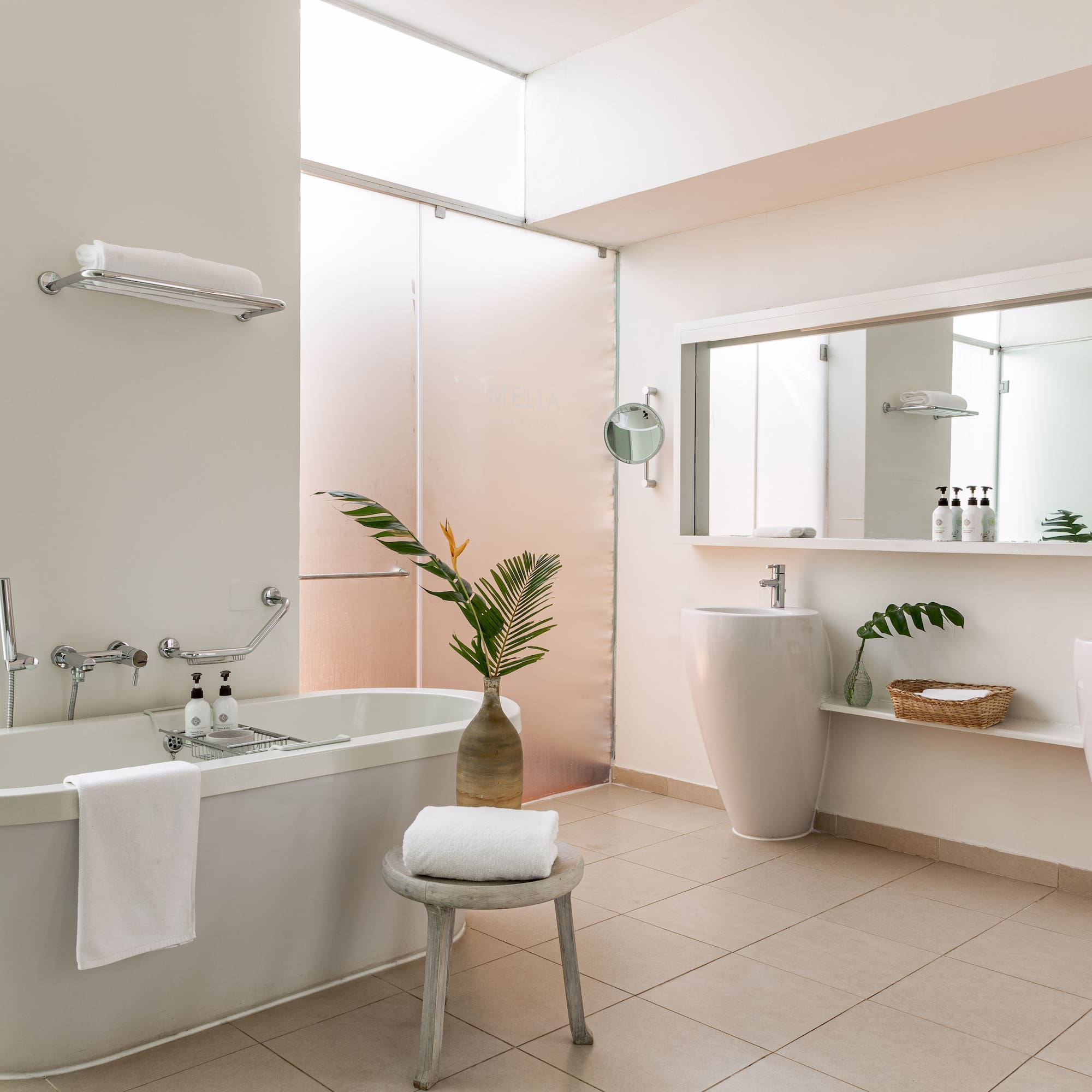 a bathroom with a tub and sink