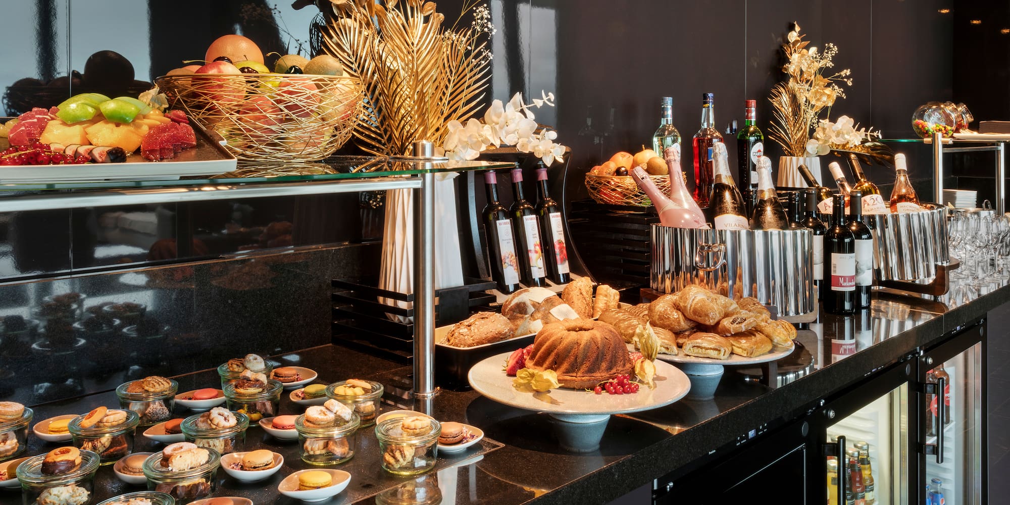a buffet table with food and drinks