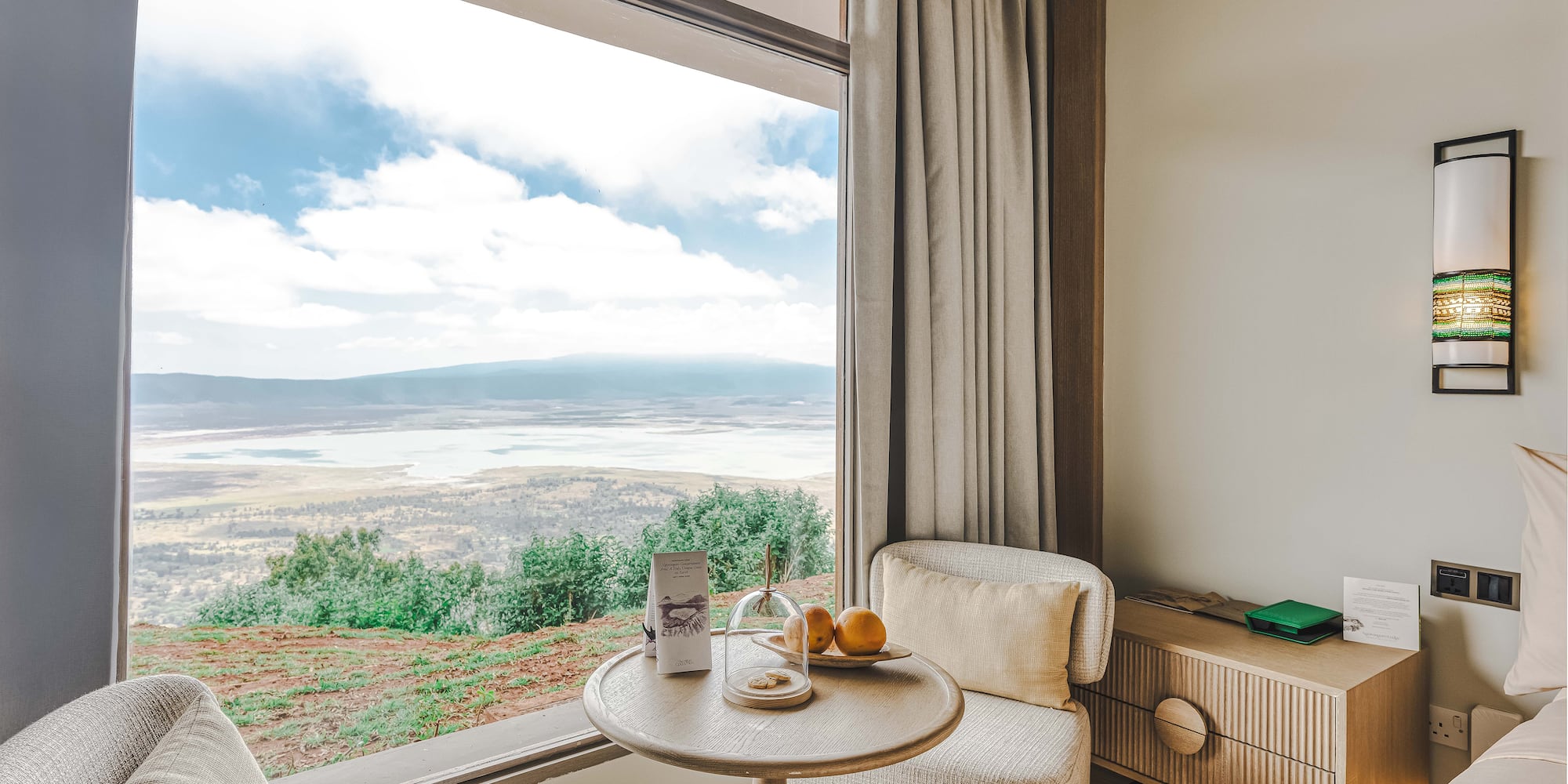 a room with a window and a table and chairs