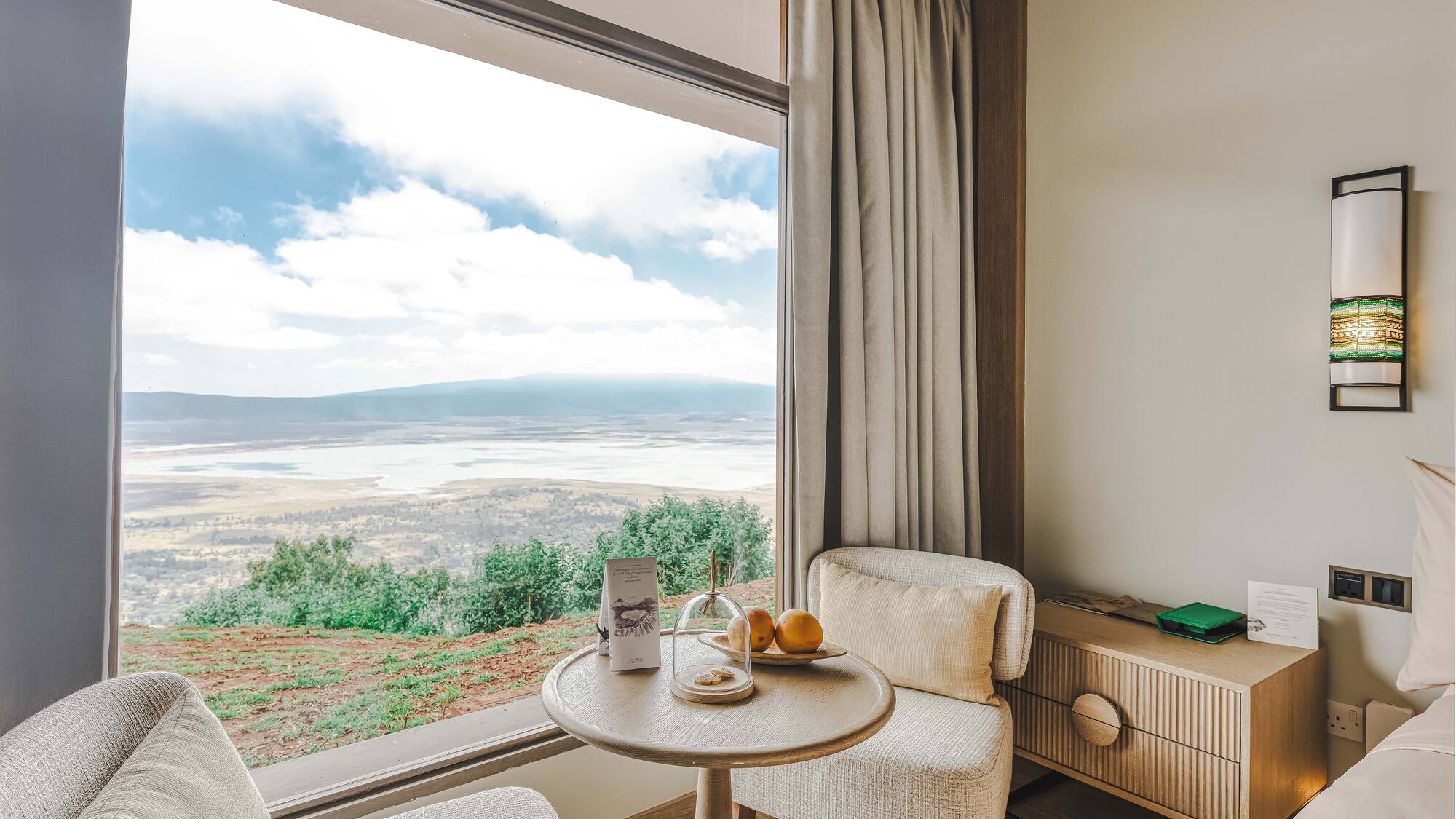 a room with a window and a table and chairs
