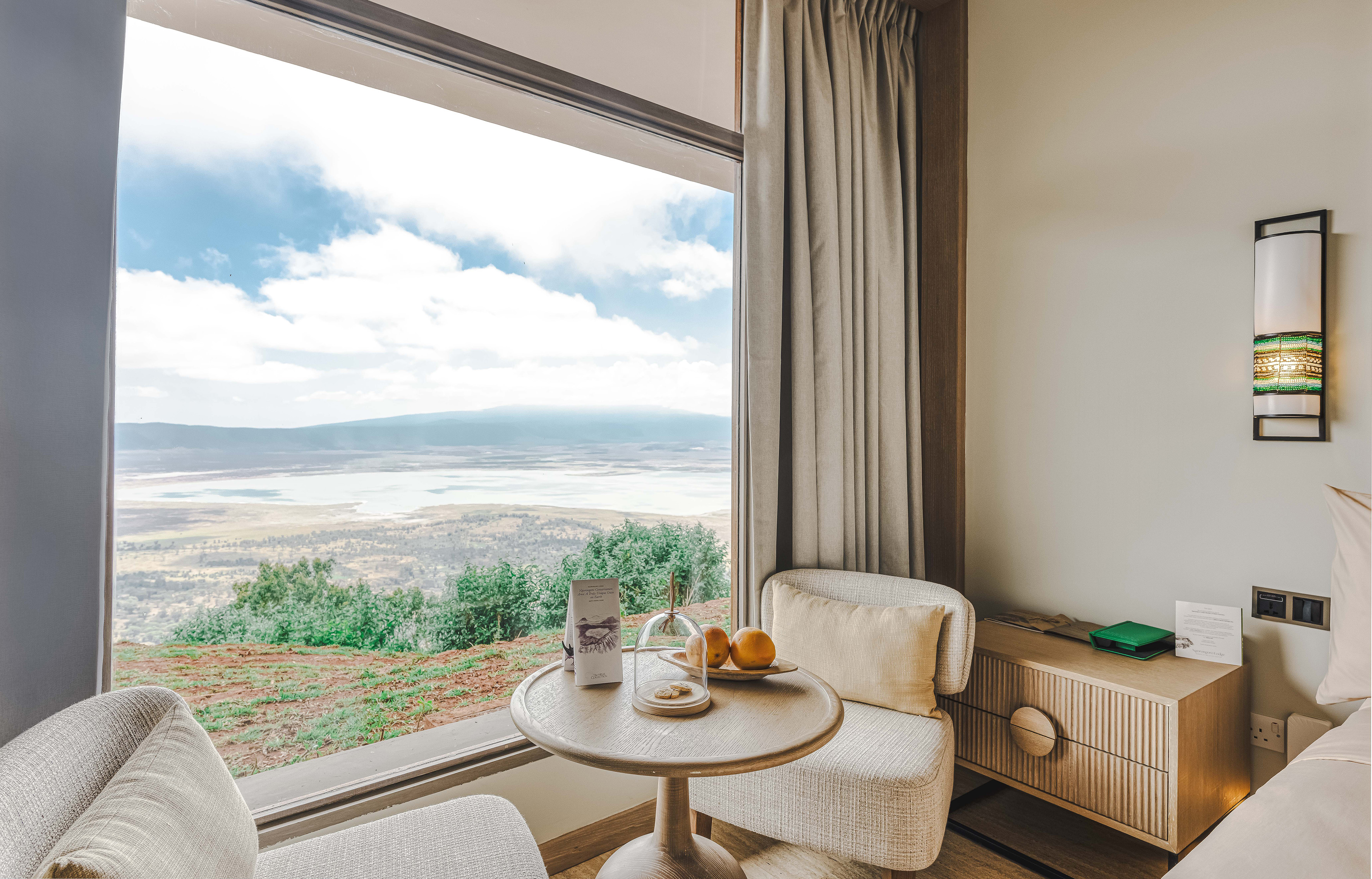Luxury lodge room with panoramic crater lake and valley view.