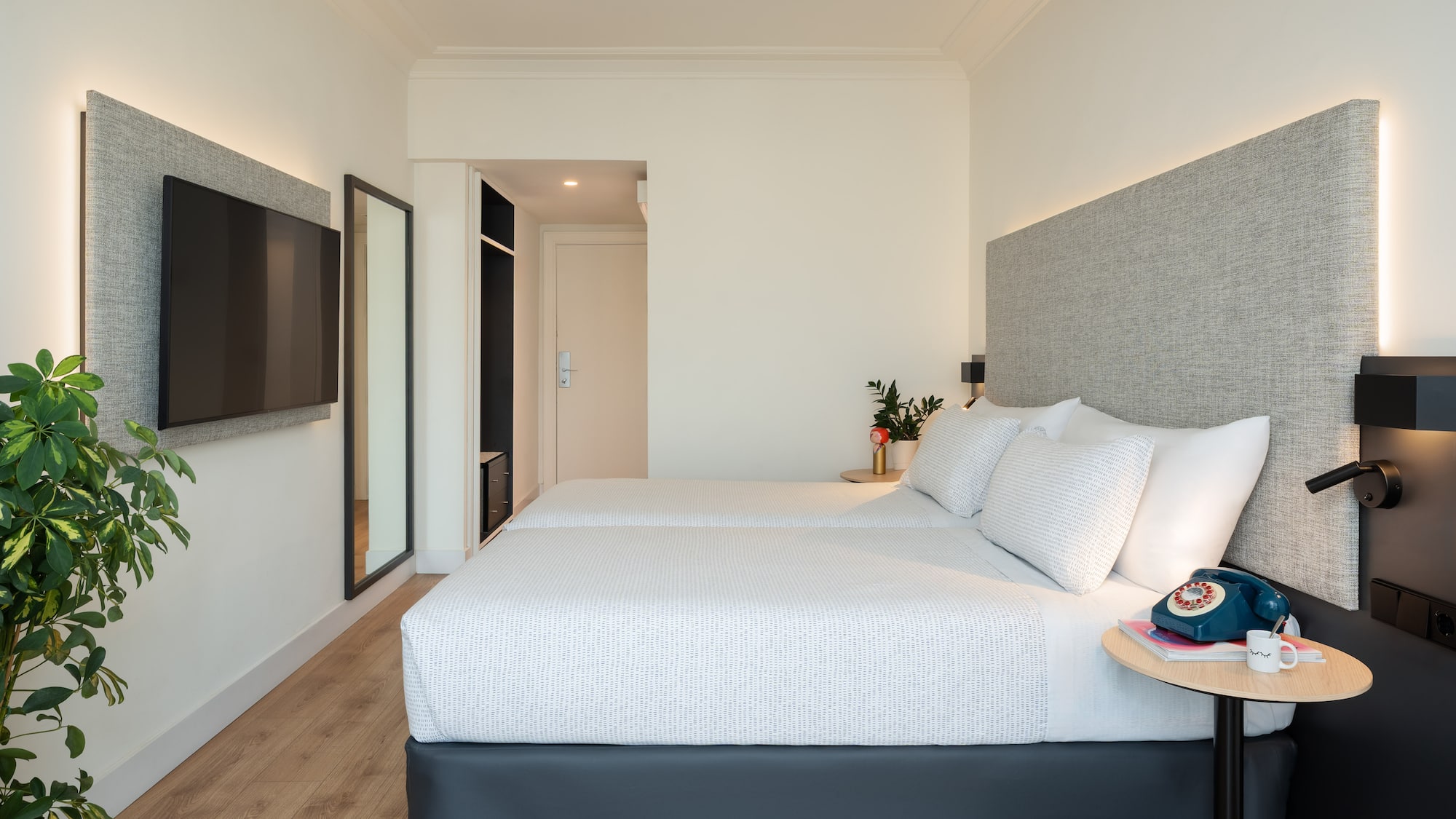 a bedroom with a bed and a tv