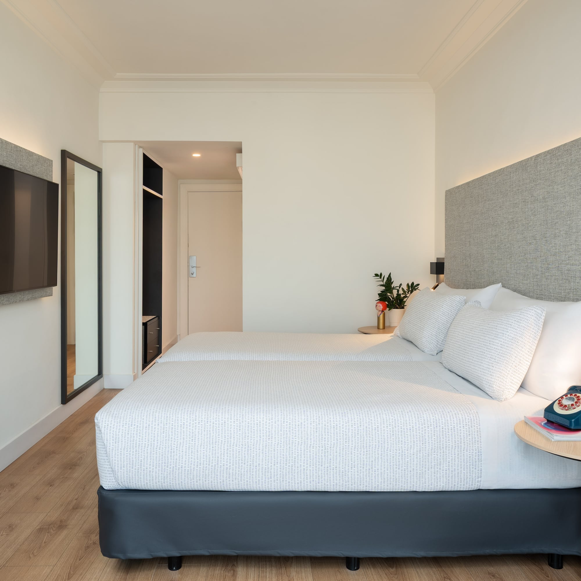 a bedroom with a bed and a tv