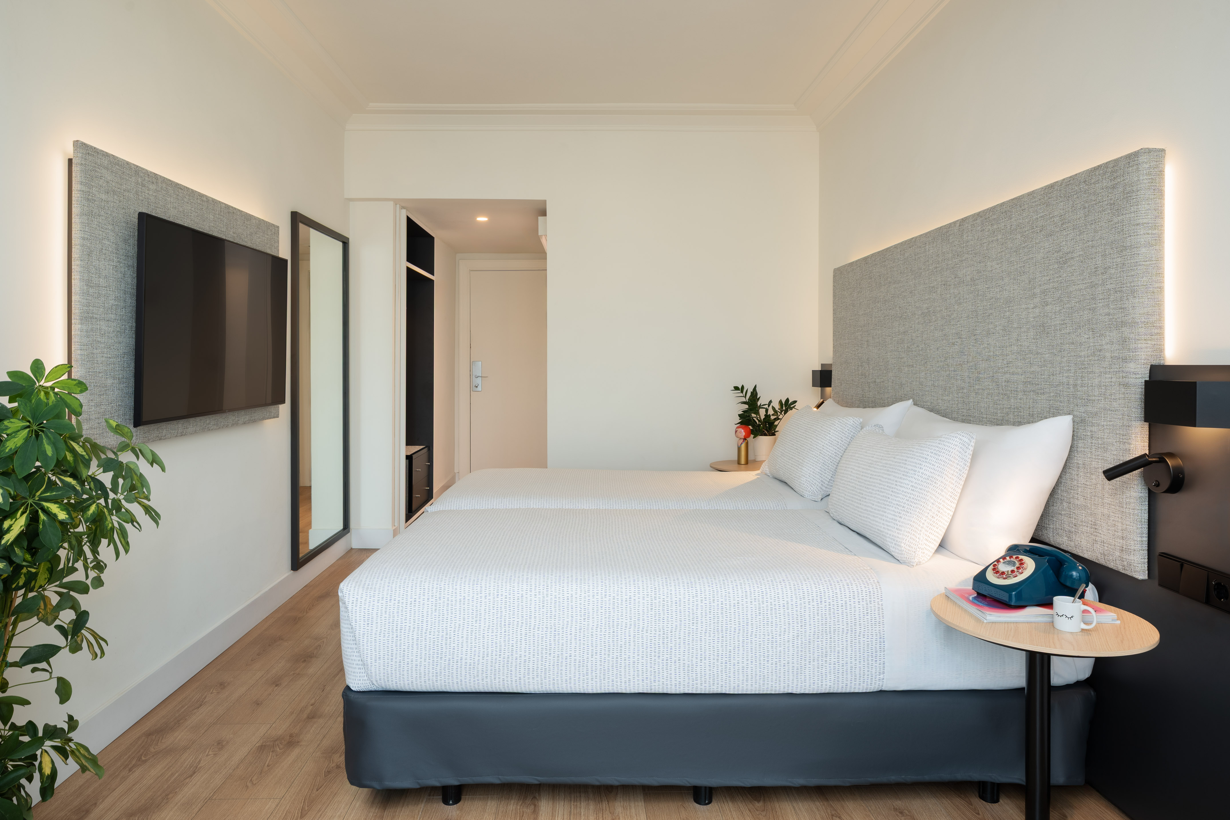 a bedroom with a bed and a tv