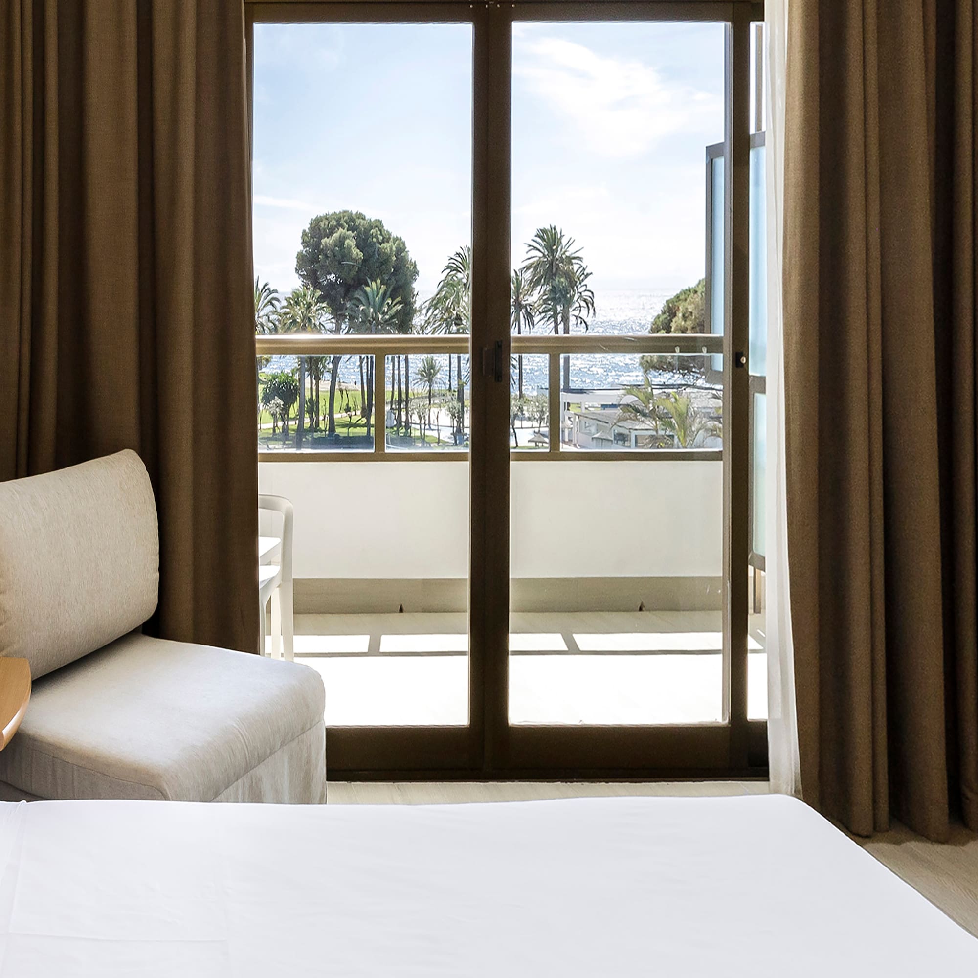 a room with a bed and a glass door